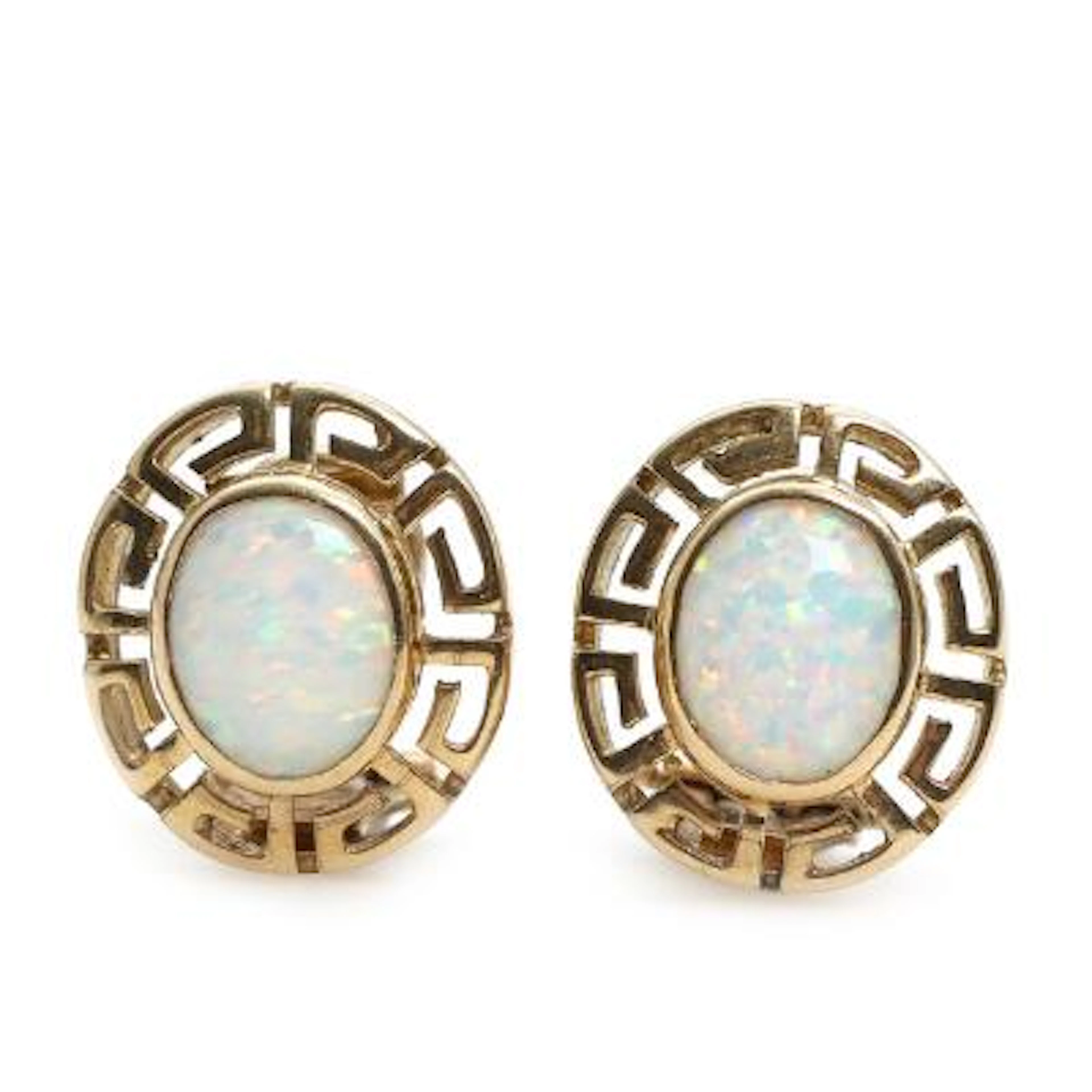 A pair of opal ear clips, each set with a cabochon, solid opal, mounted