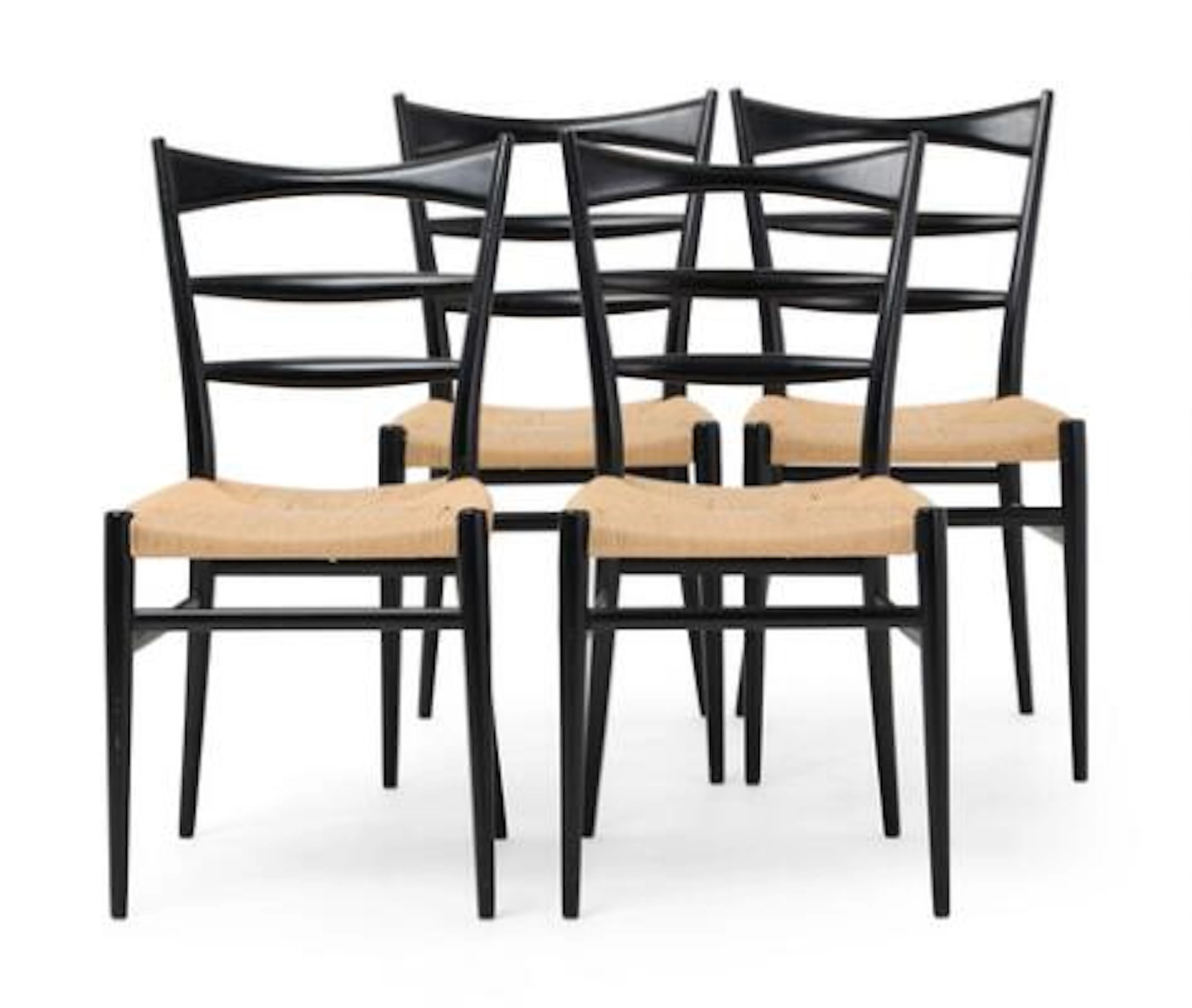 Italian design: Set of four chairs in black lacquered wood. Seat with
