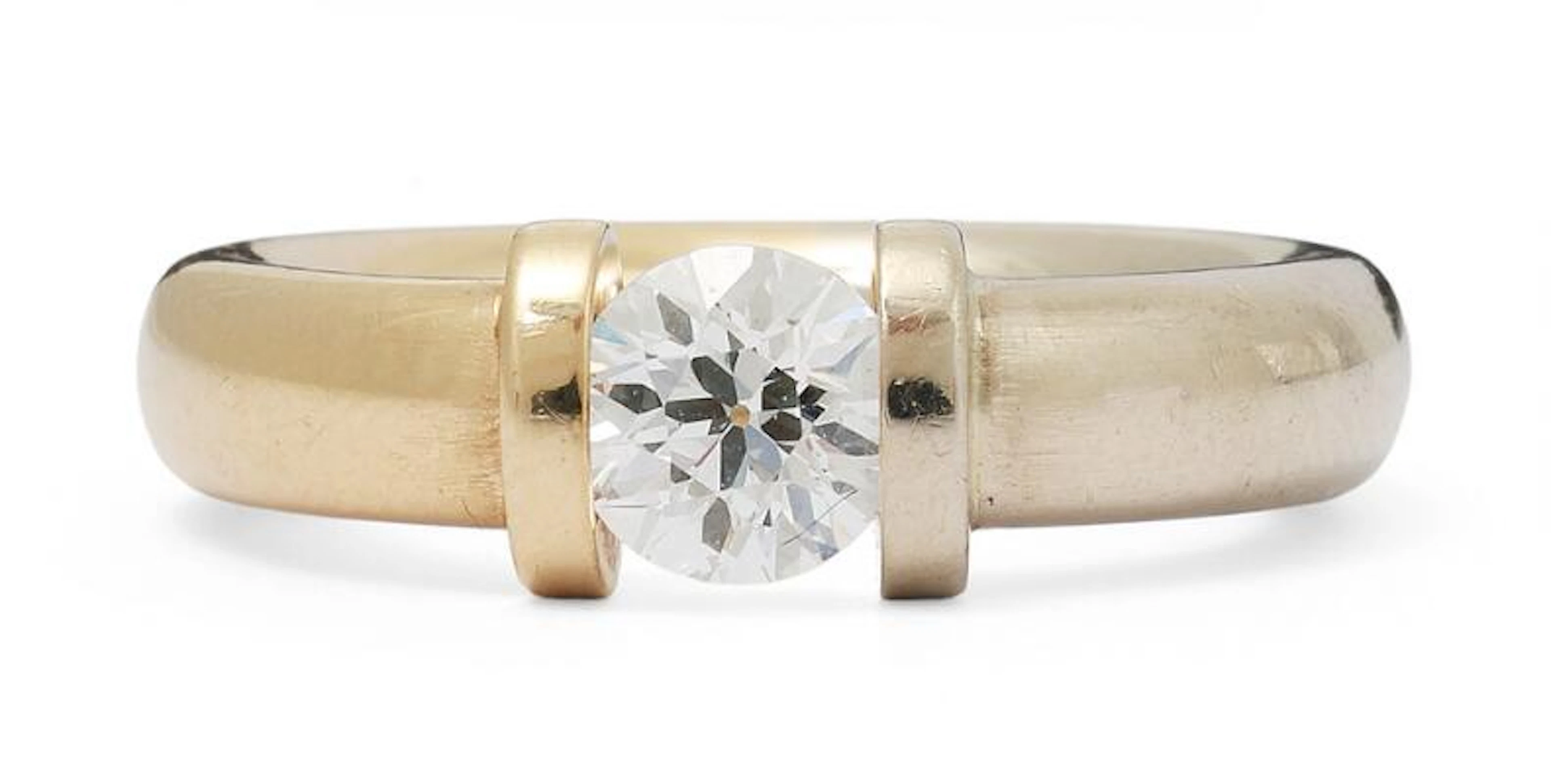 A diamond ring set with a brilliant-cut diamond, mounted in 14k gold.