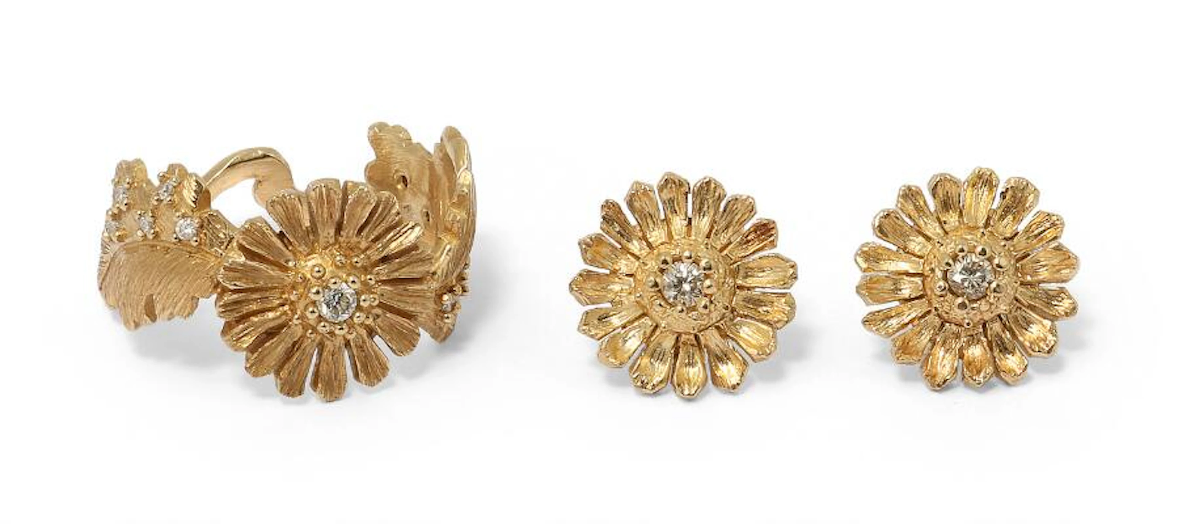 A diamond jewellery set comprising of a pair of ear studs and a ring