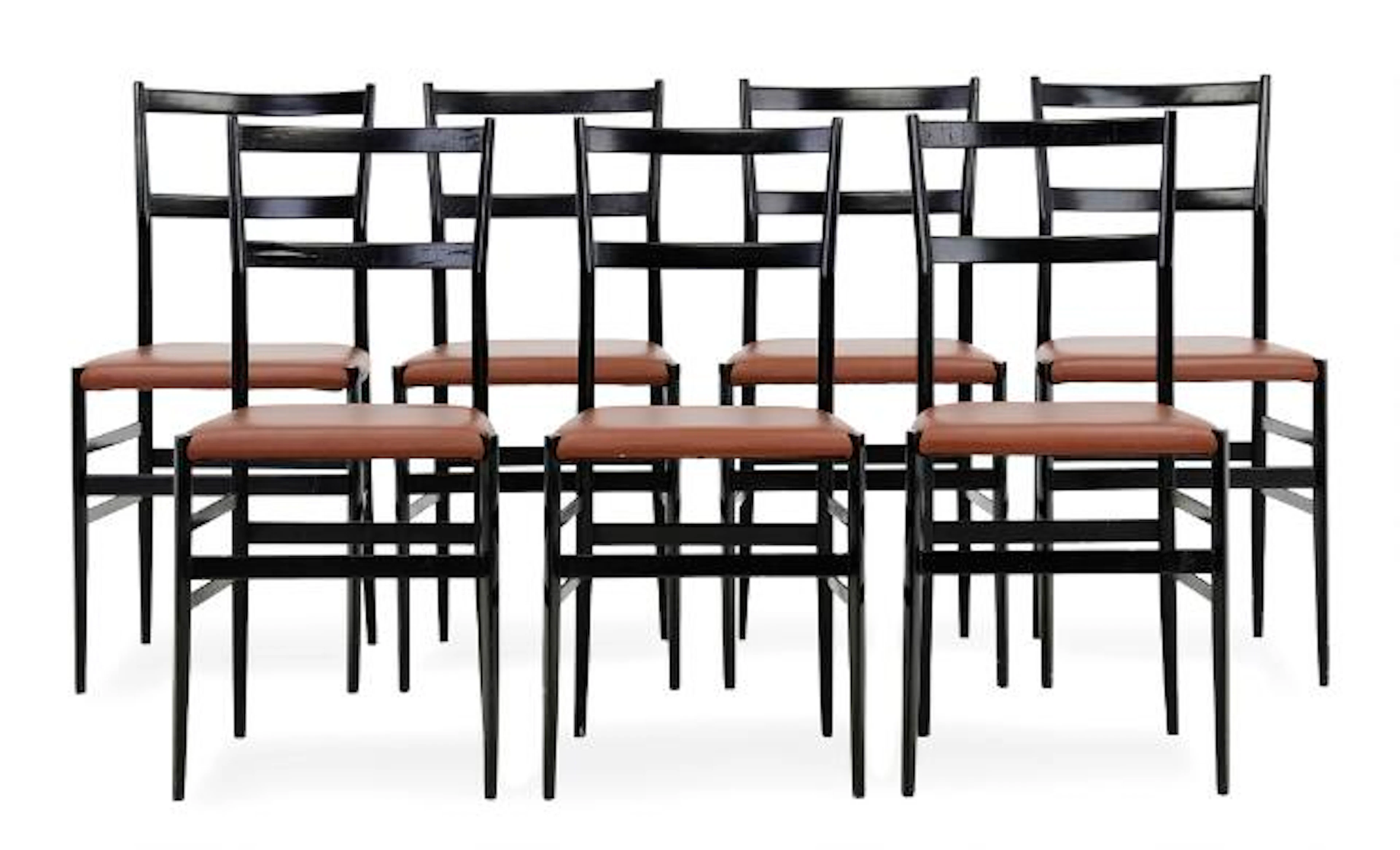 Gio Ponti: “Superleggera”. Set of seven chairs of black lacquered