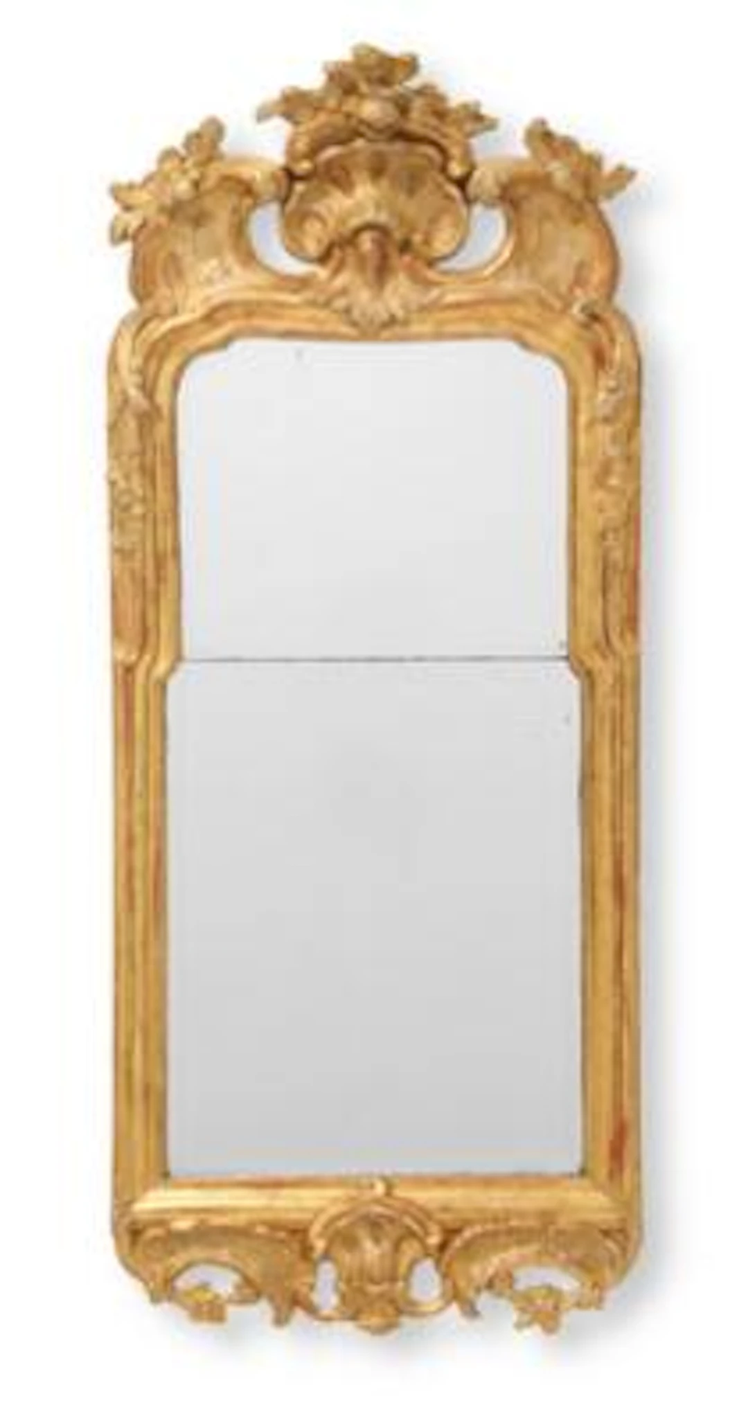 A Swedish Rococo mirror in giltwood frame. The back stamped with Stockholm