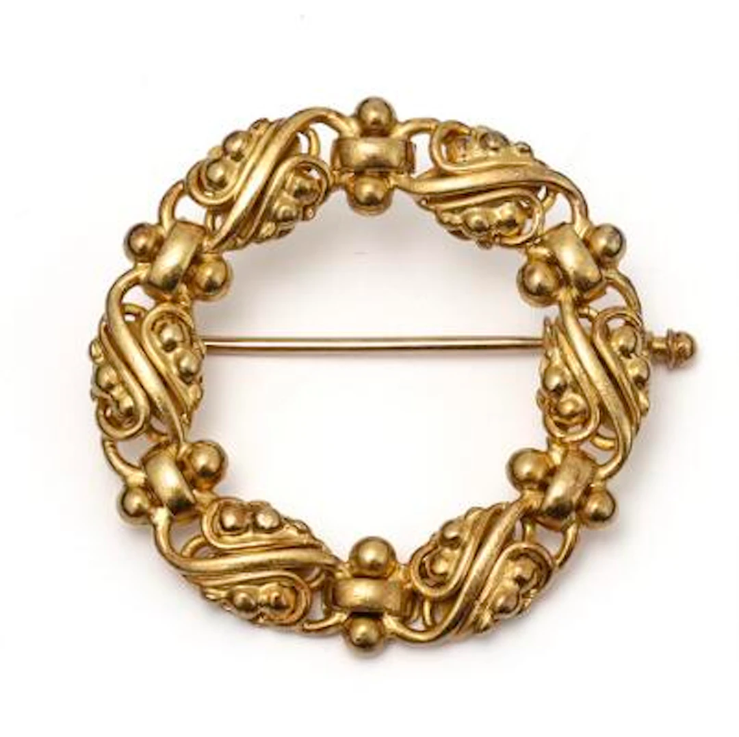 Evald Nielsen: A brooch of 14k gold. Weight app. 7.35 g. Diam. 3 cm.