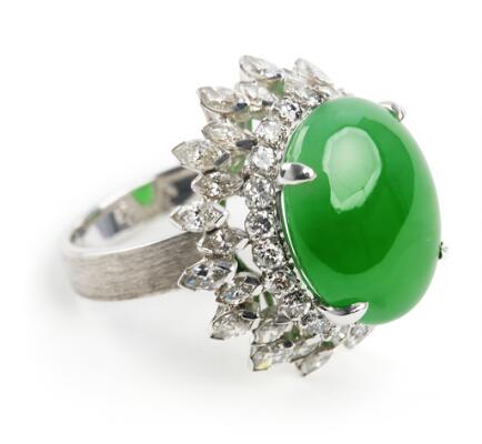 A 'Fei Cui' jade ring set with a jadeite jade encircled by numerous