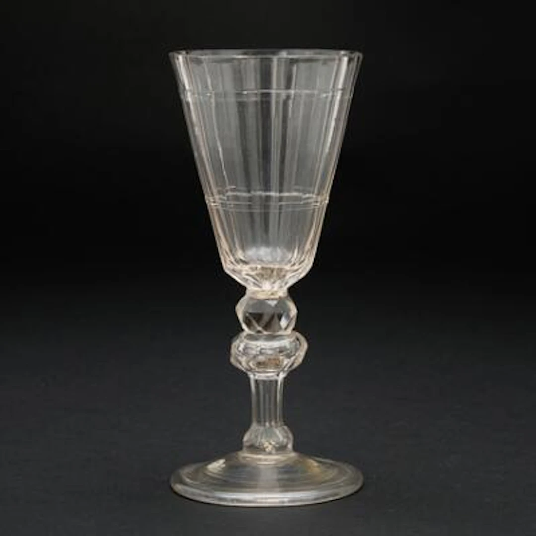 Early glass with conical longitudinally facetted cup. Potsdam, 1700.