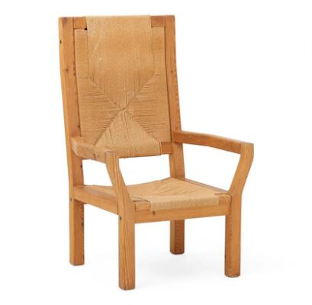 Tage Poulsen: High-backed armchair of solid pine wood. Seat and back
