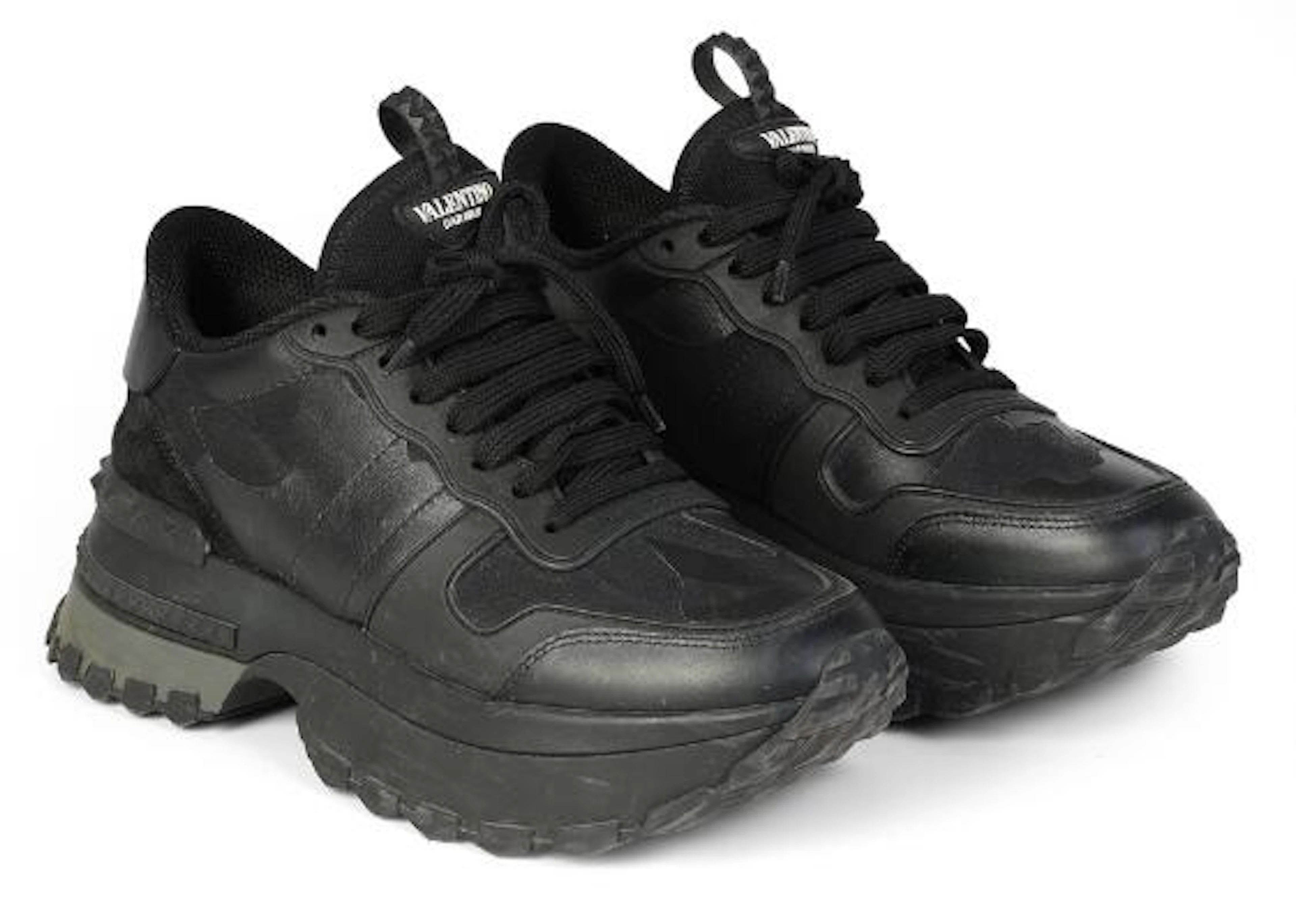 Valentino: A pair of black snekers of partly leather and canvas with
