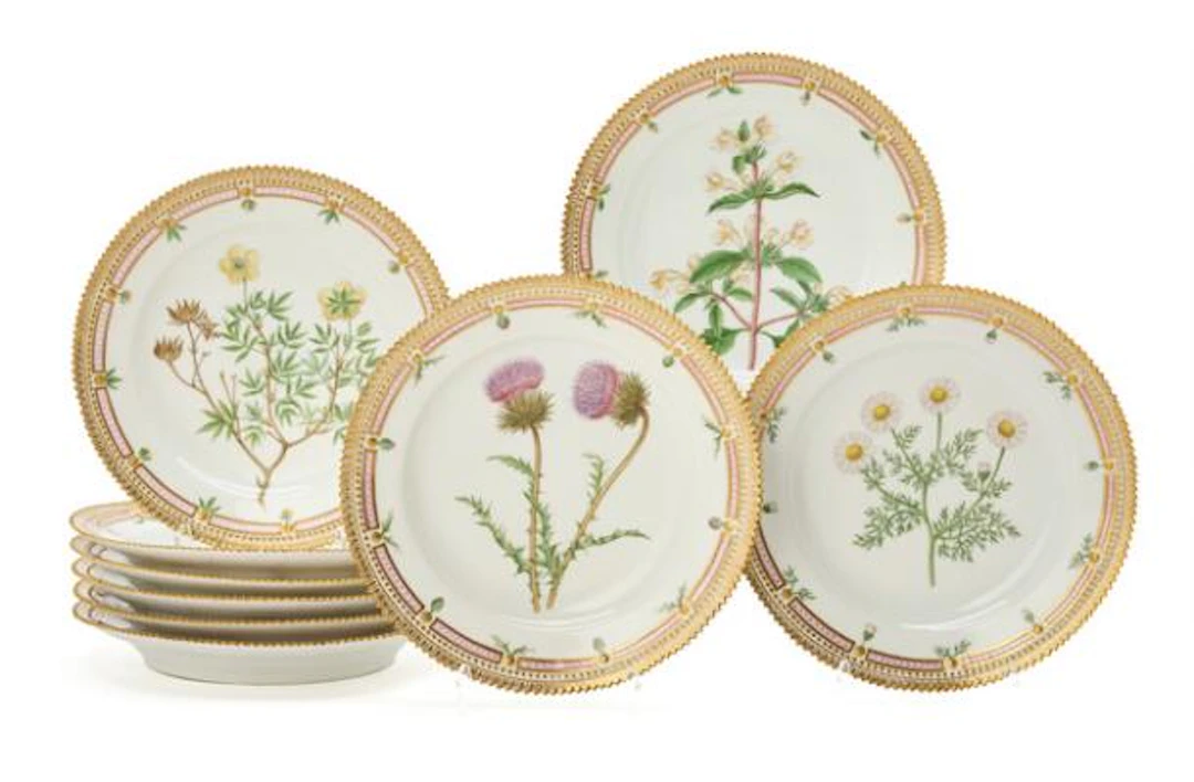 Nine "Flora Danica" enamelled and gilt porcelain lunch plates. Royal