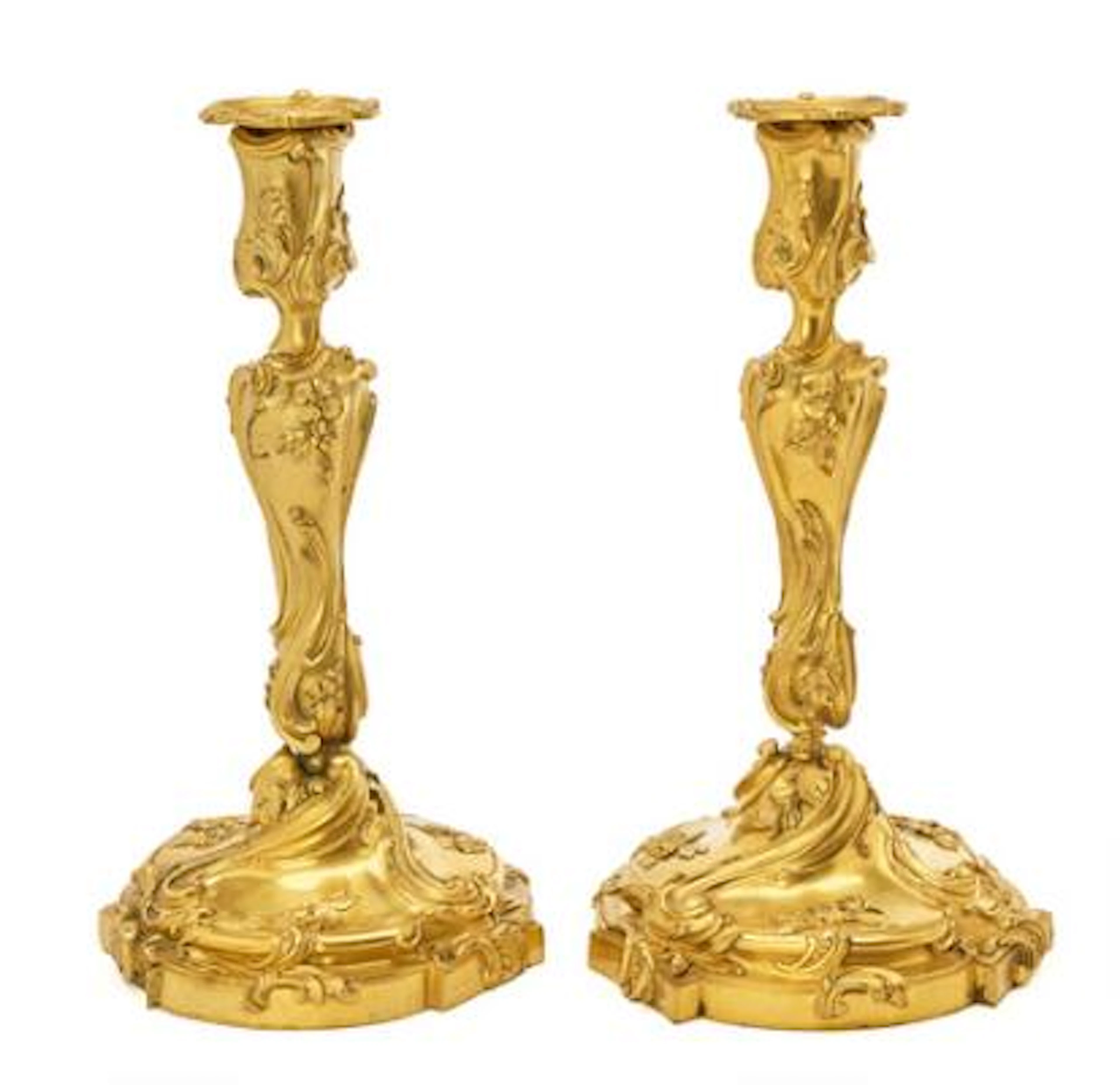 A pair of large French candlesticks in gilded bronze. Second half