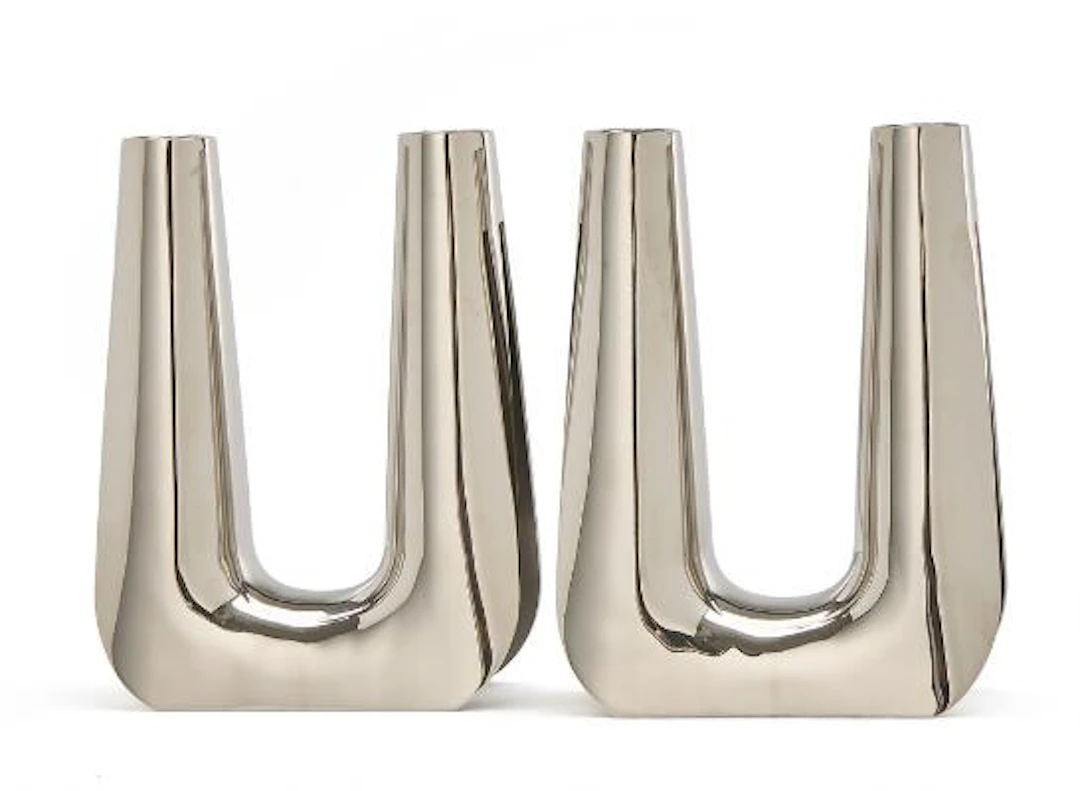Søren Georg Jensen: A pair of stainless steel candelabra. Smooth