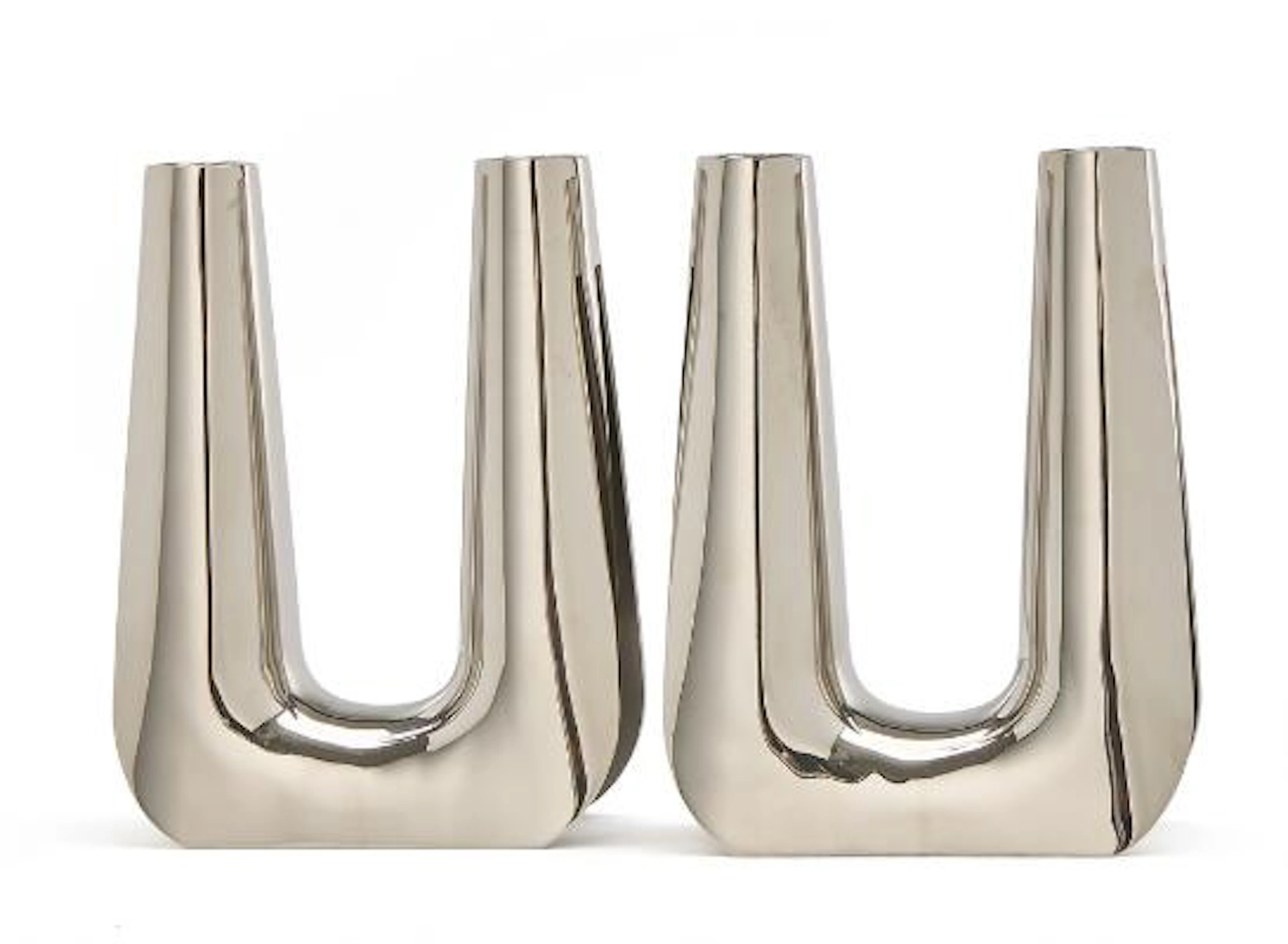 Søren Georg Jensen: A pair of stainless steel candelabra. Smooth