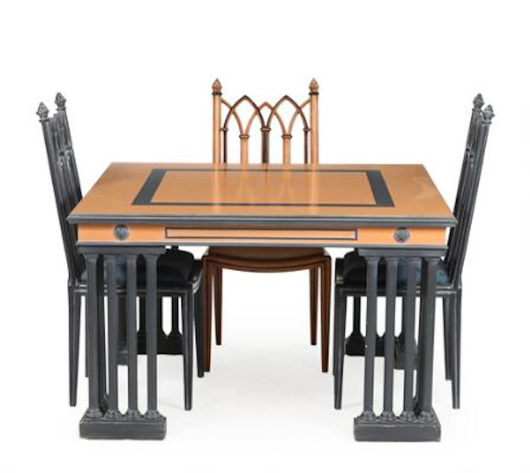 A 20th century partially painted Gothic style dining table and three