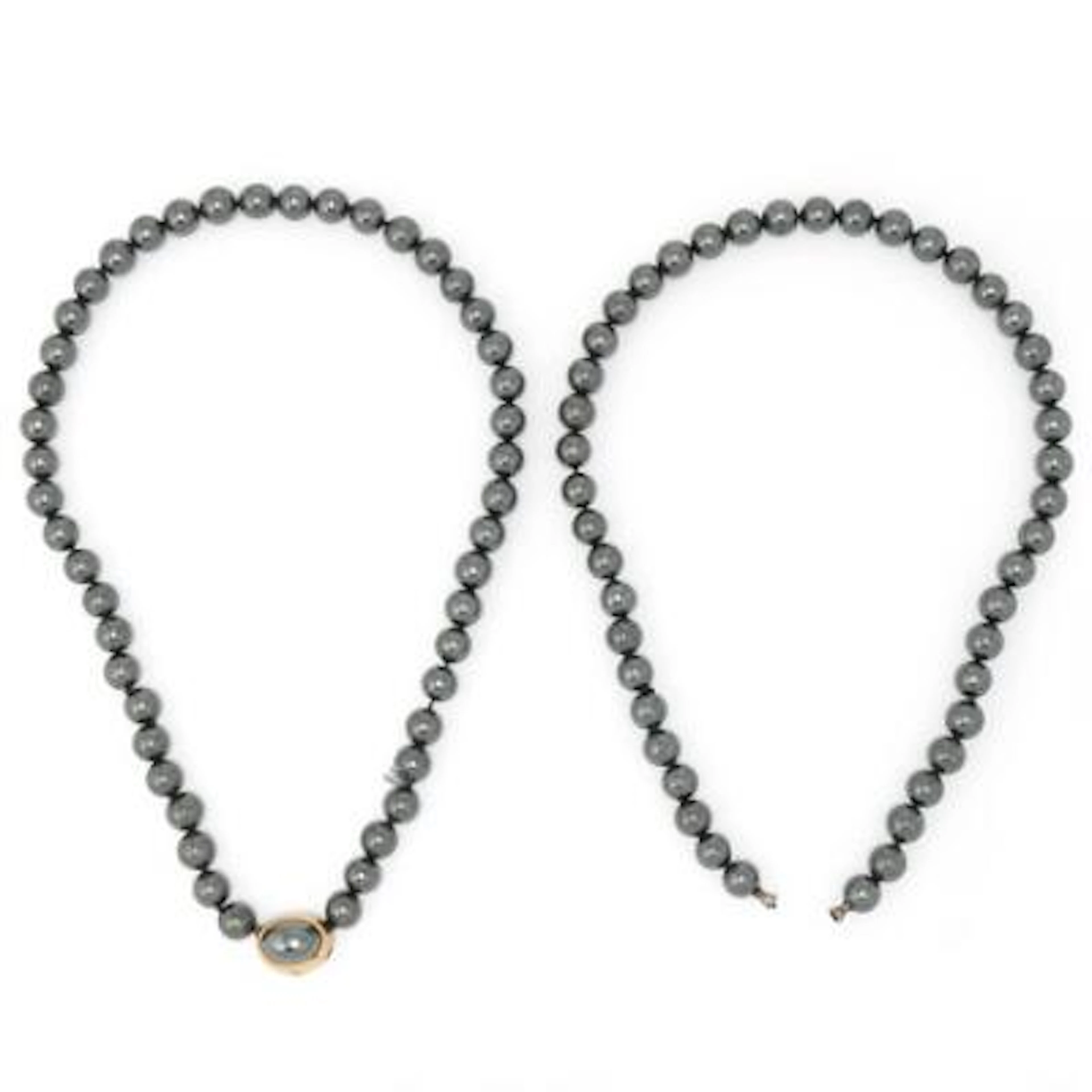 Ole Lynggaard: A hematite clasp set with a cabochon hematite, mounted