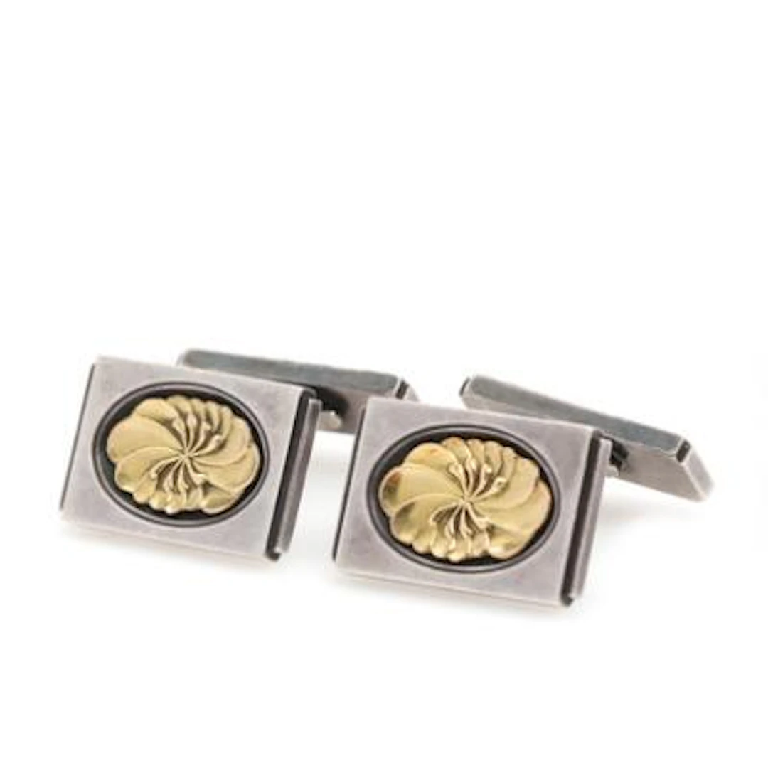 Georg Jensen: A pair of cufflinks of sterling silver and 18k gold.