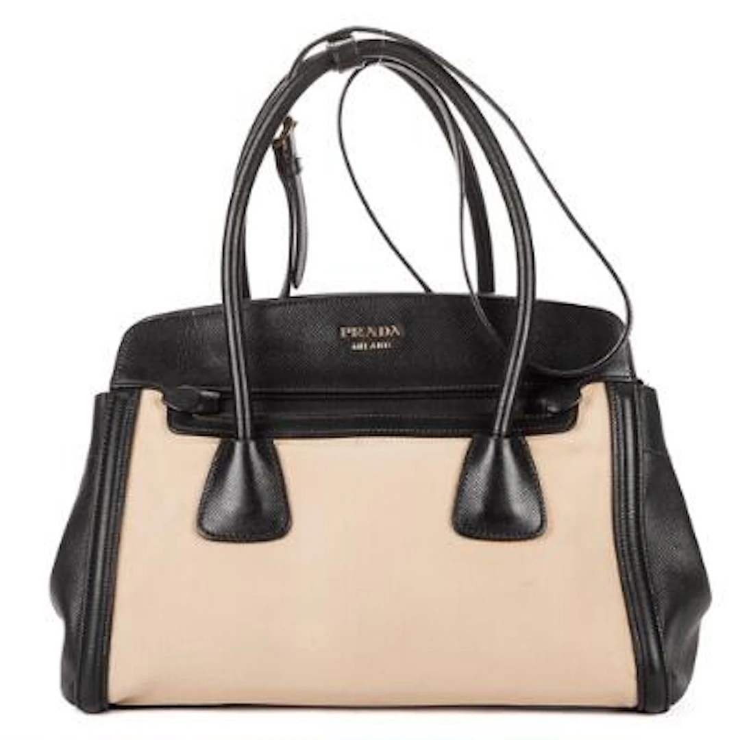 Prada: An "Open Tote" in partly black leather and beige canvas with