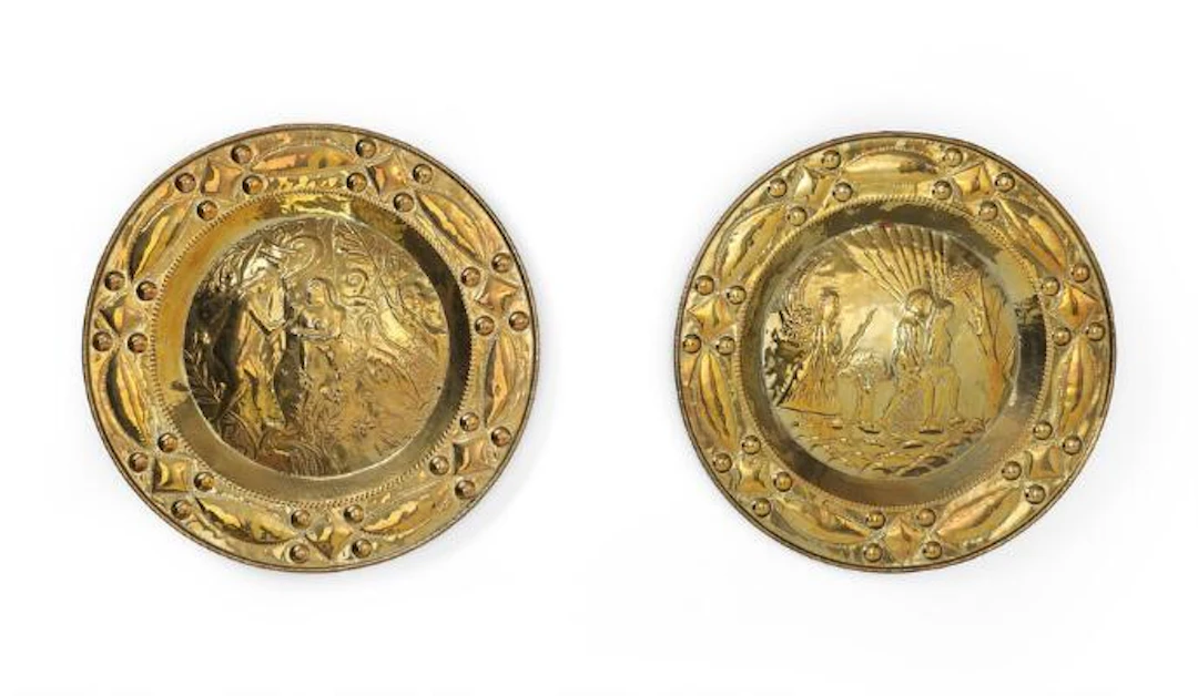 Two baptismal basins in Baroque style of chased and punched brass.