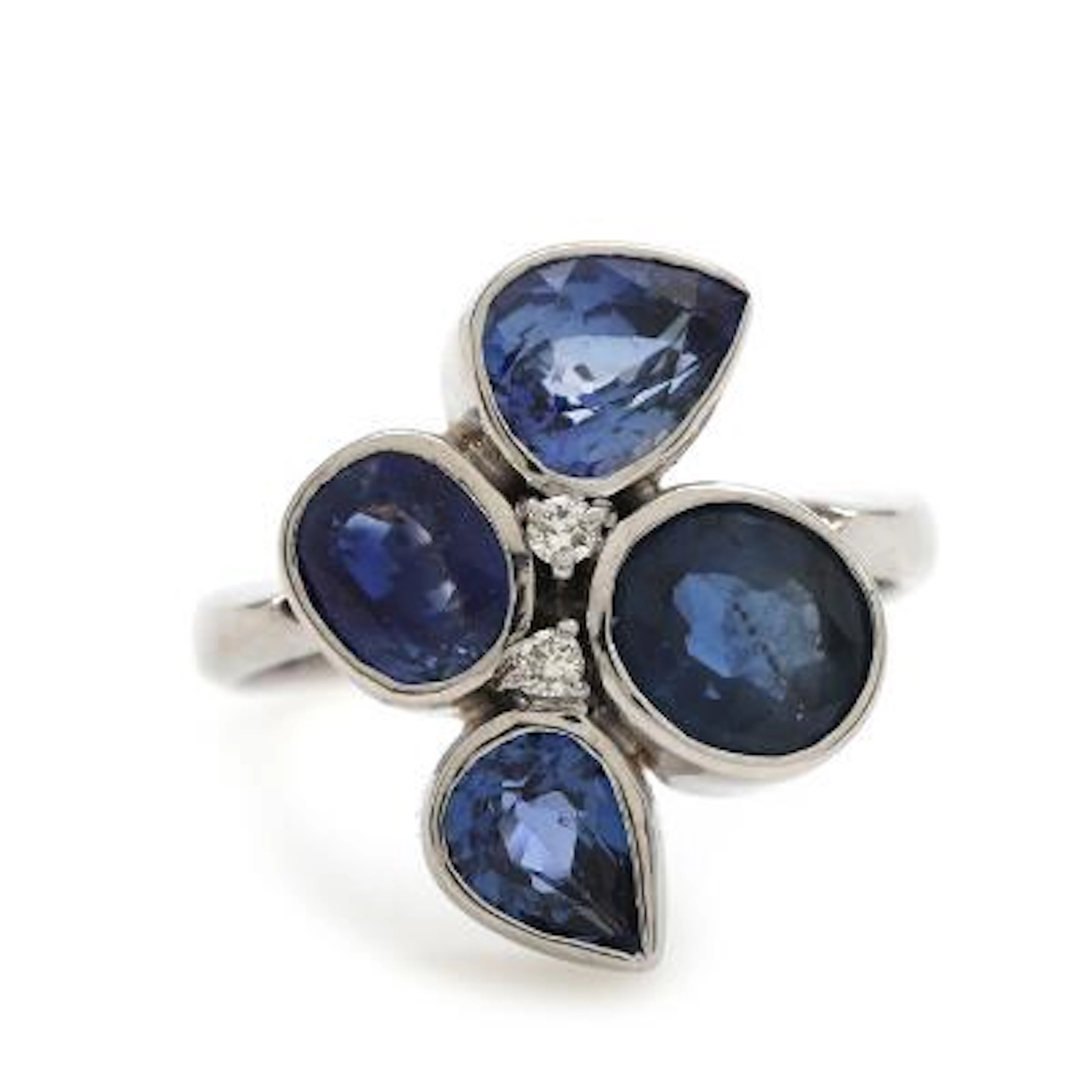 A sapphire and diamond ring set with faceted sapphires and brilliant-cut