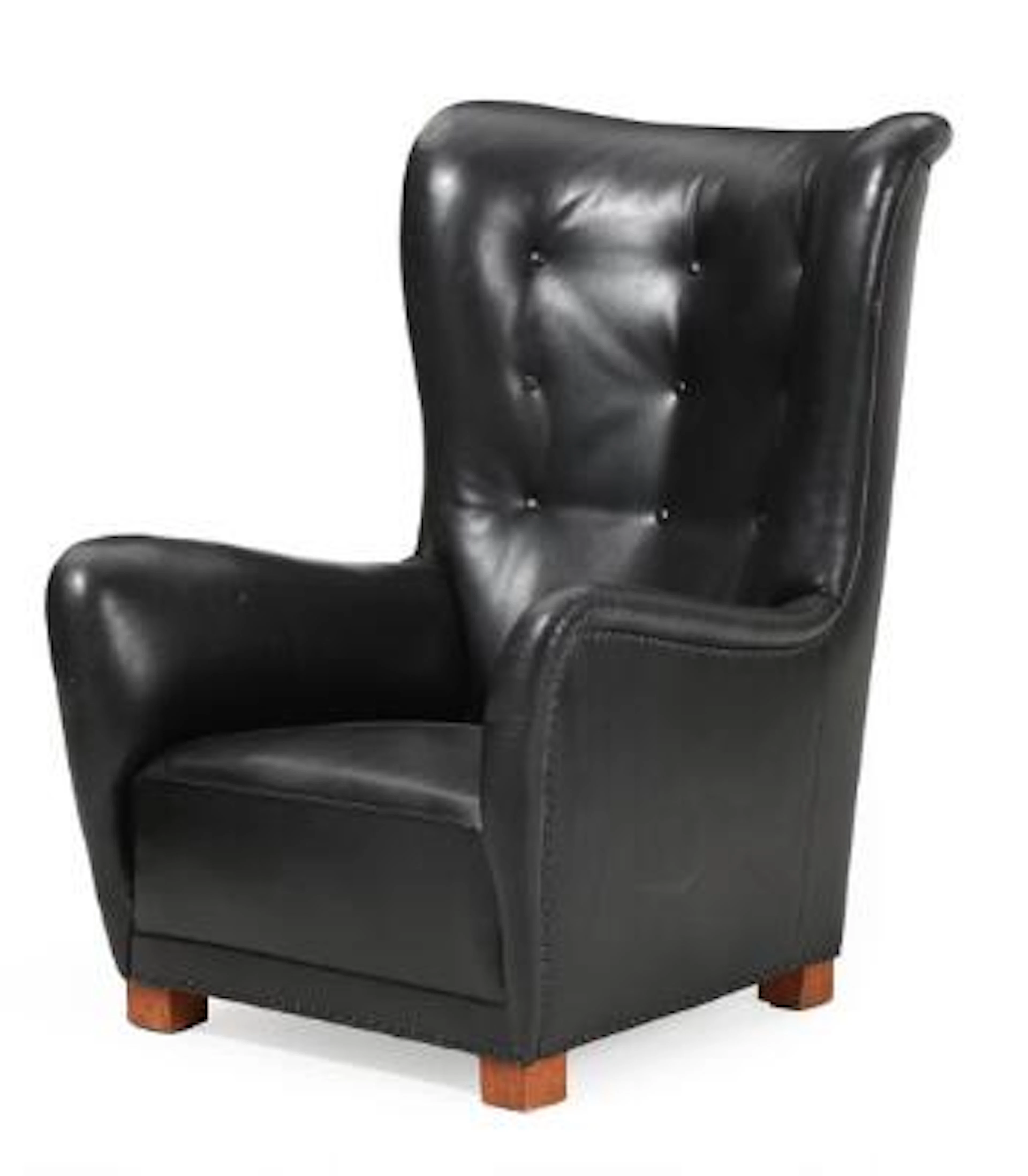 Fritz Hansen: High-backed wing chair with black leather, beech legs.