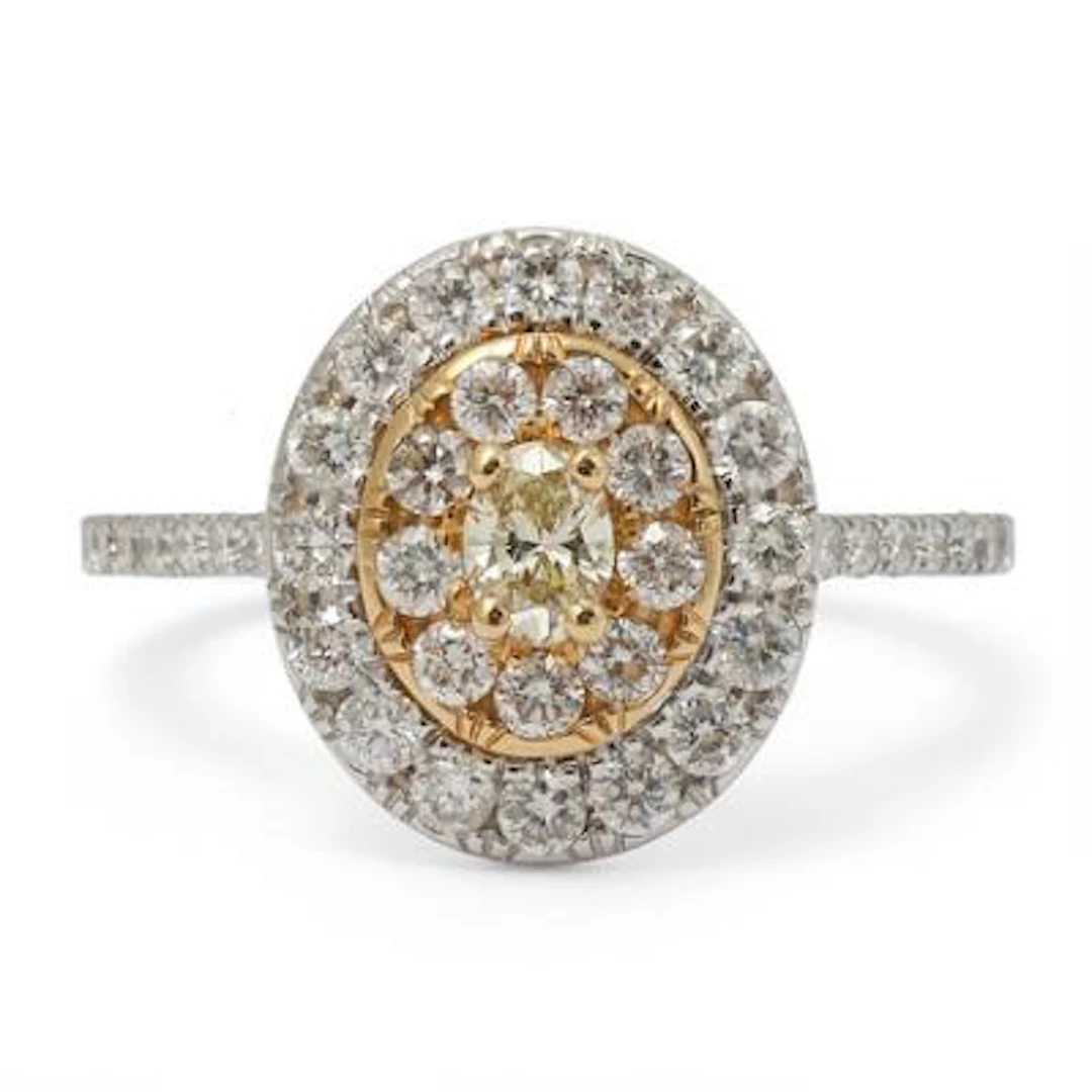 A diamond ring set with a yellow diamond encircled by numerous diamonds