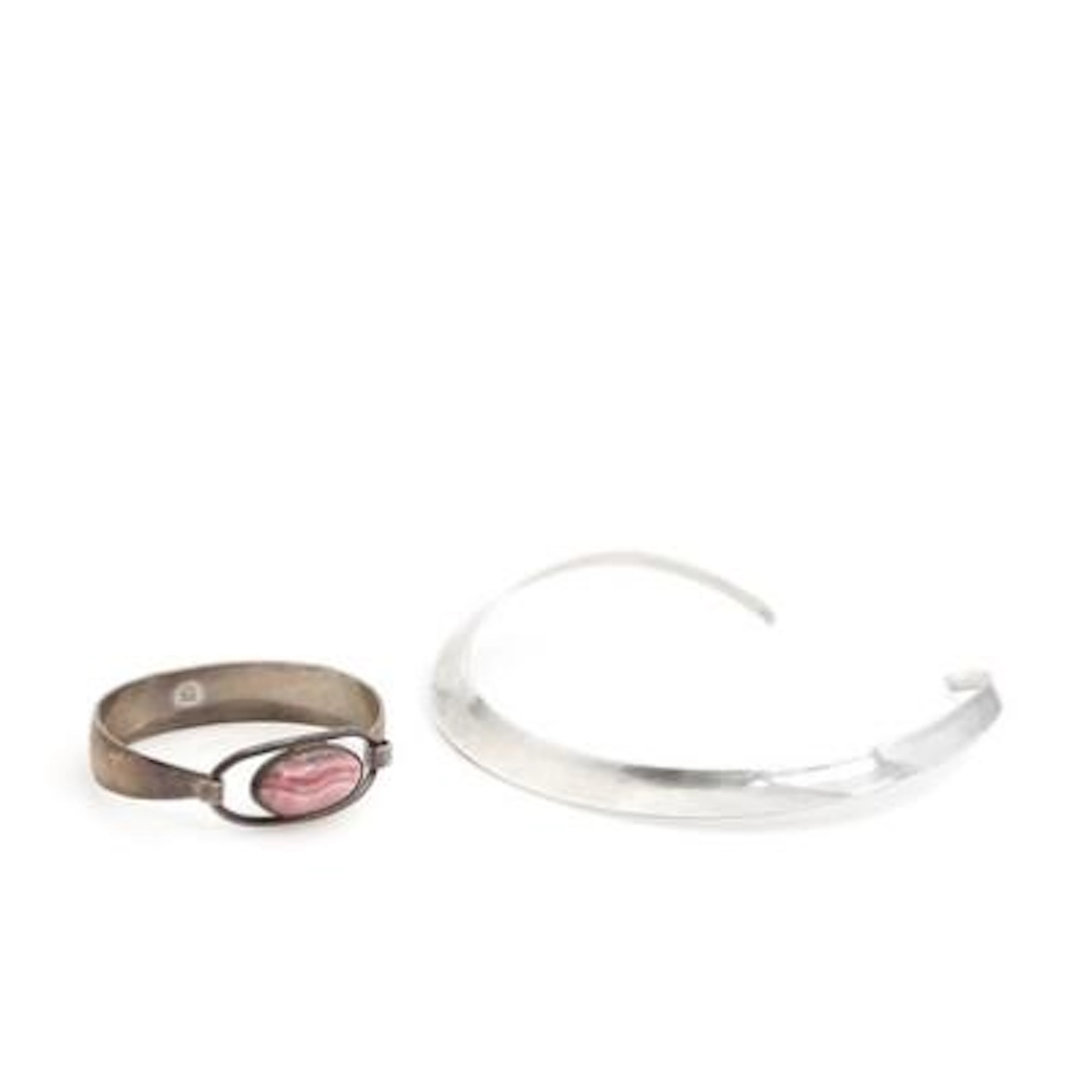 N. E. From a.o. : A sterling silver bangle and necklace. Bangle inside