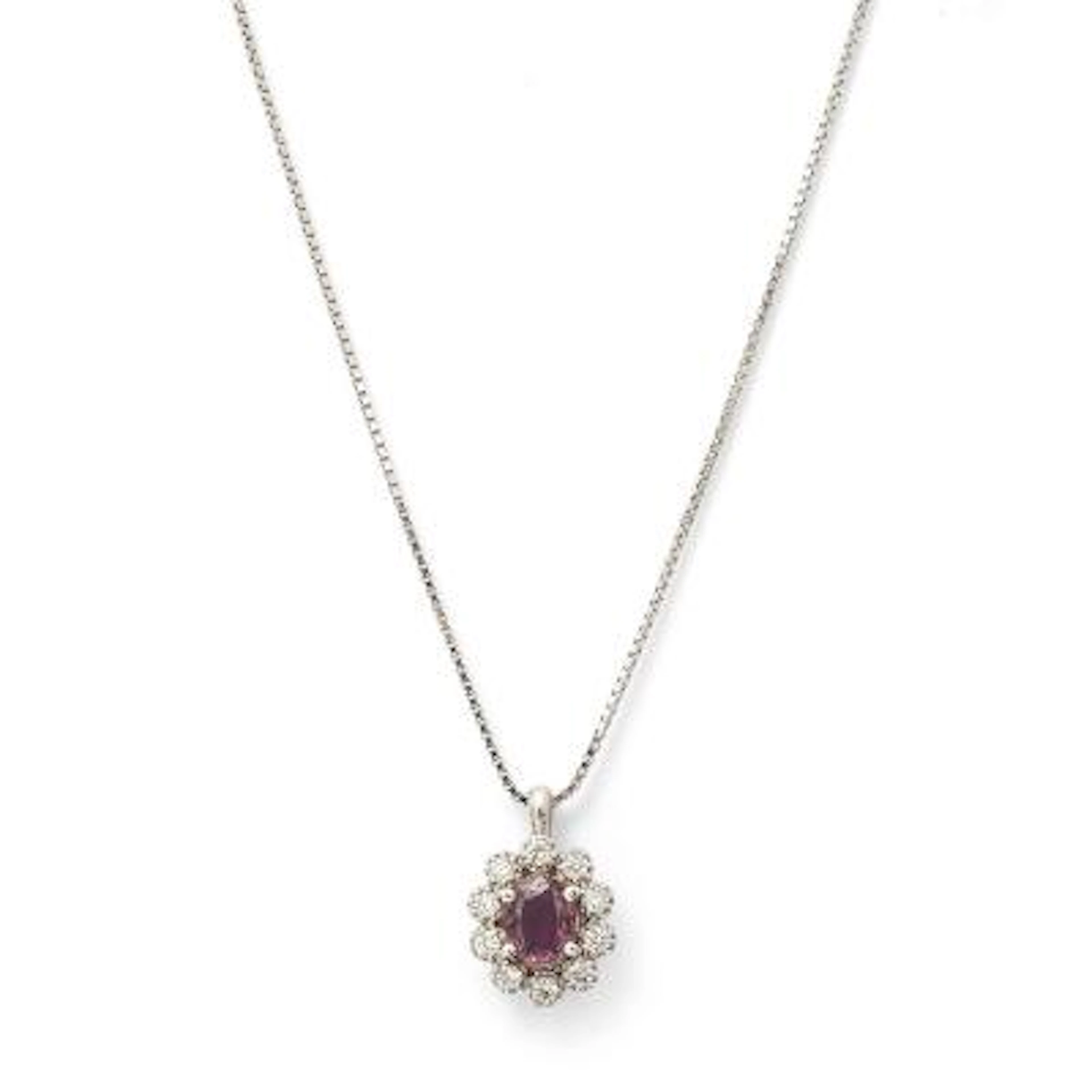 A ruby and diamond necklace set with a ruby encircled by diamonds