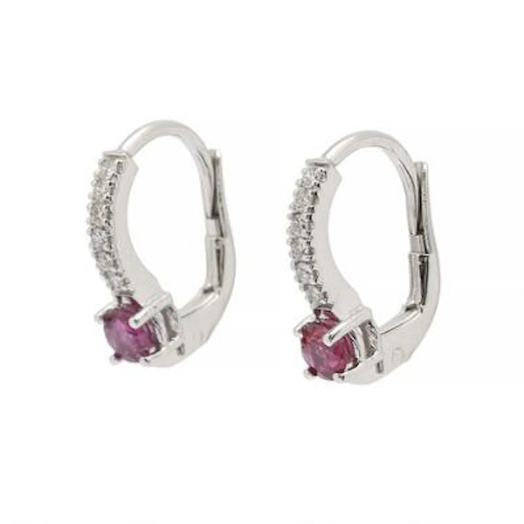 A pair of ruby and diamond ear studs each set with a ruby and diamonds