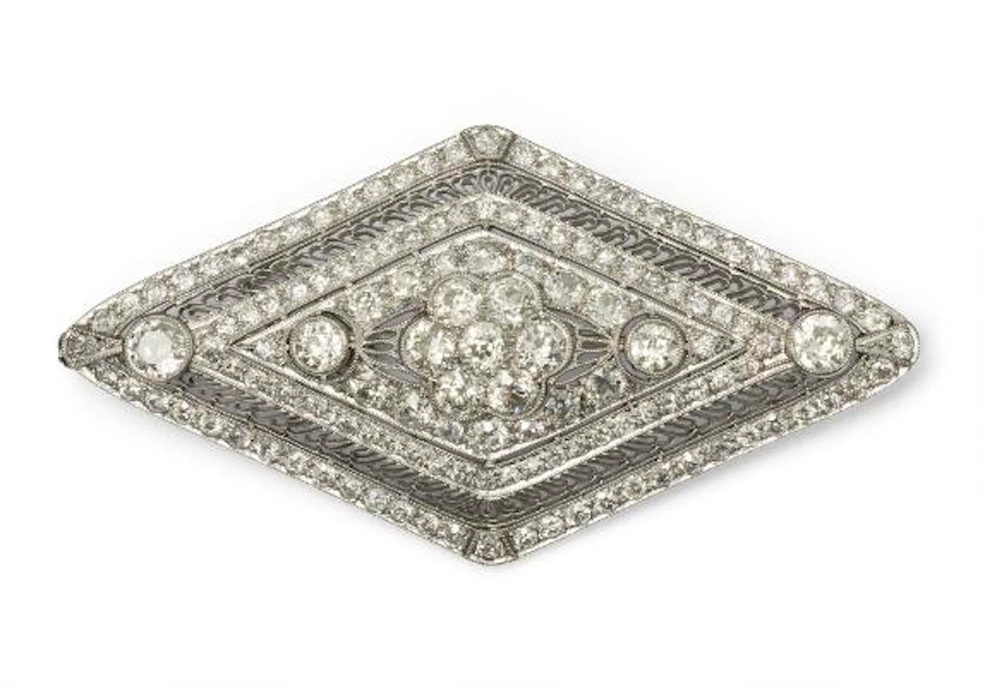 A diamond brooch set with numerous old-cut diamonds, mounted in platinum.