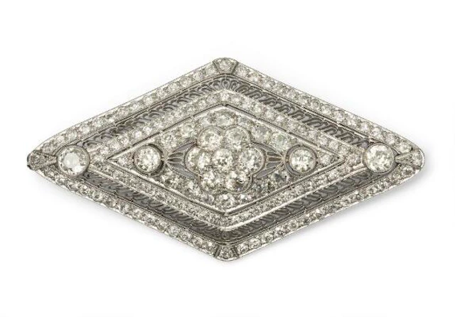 A diamond brooch set with numerous old-cut diamonds, mounted in platinum.