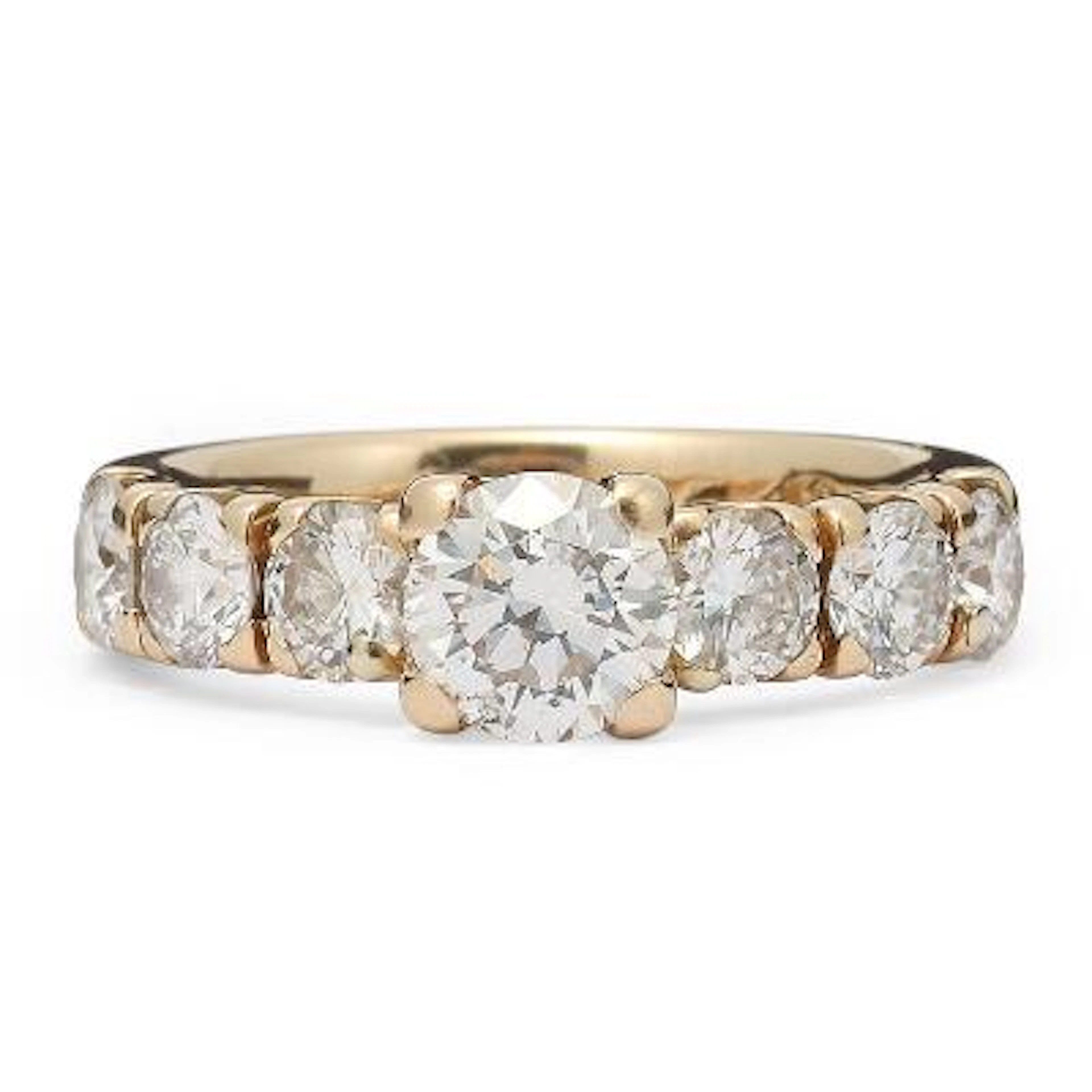 A diamond ring set with seven brilliant-cut diamonds, mounted in 14k