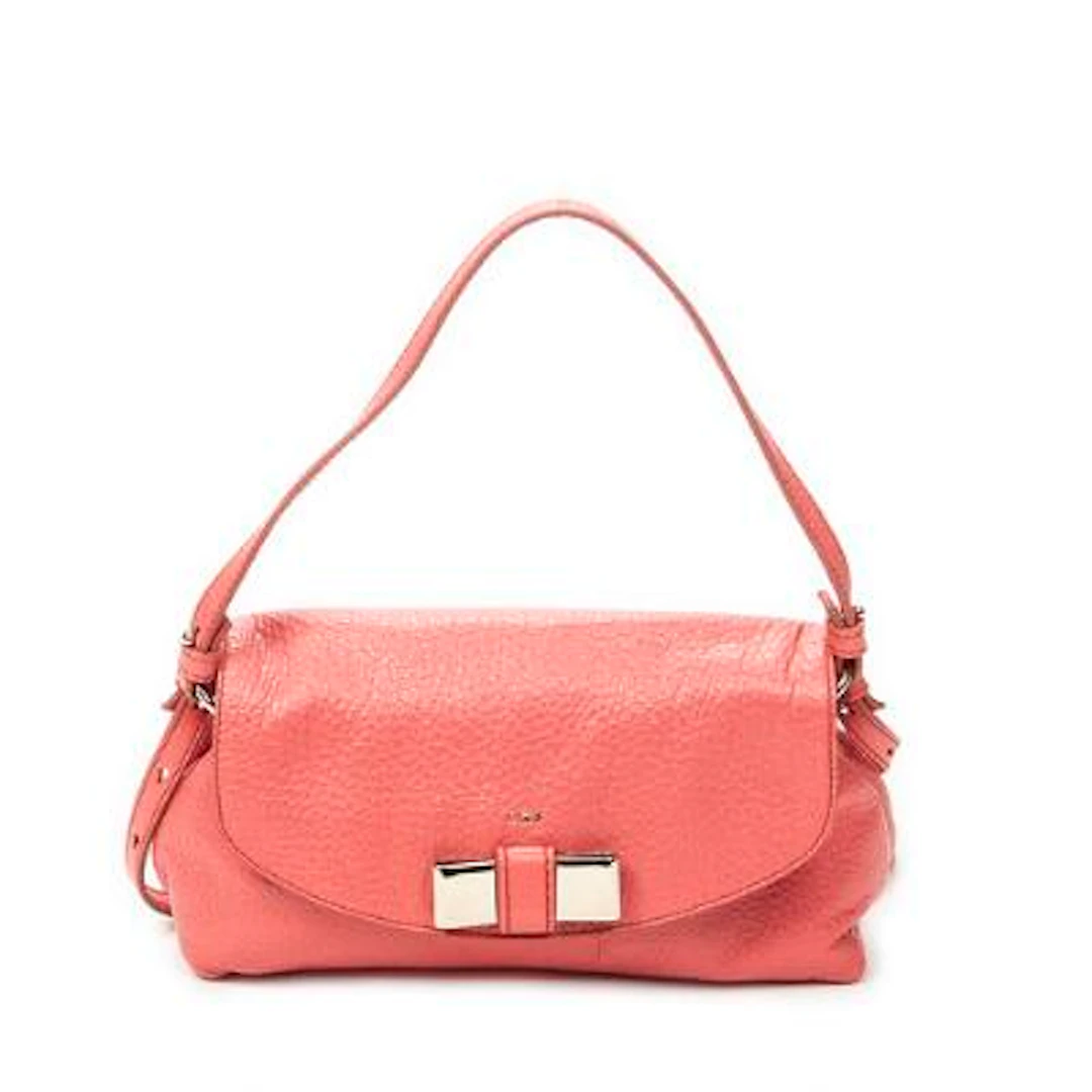 Chloé: A "Lily Crossbody" bag in pink leather with a handle and a