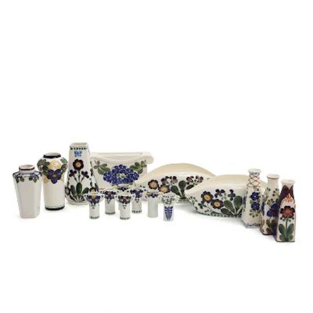 A selection of vases and jardinières of faience, decorated in colours