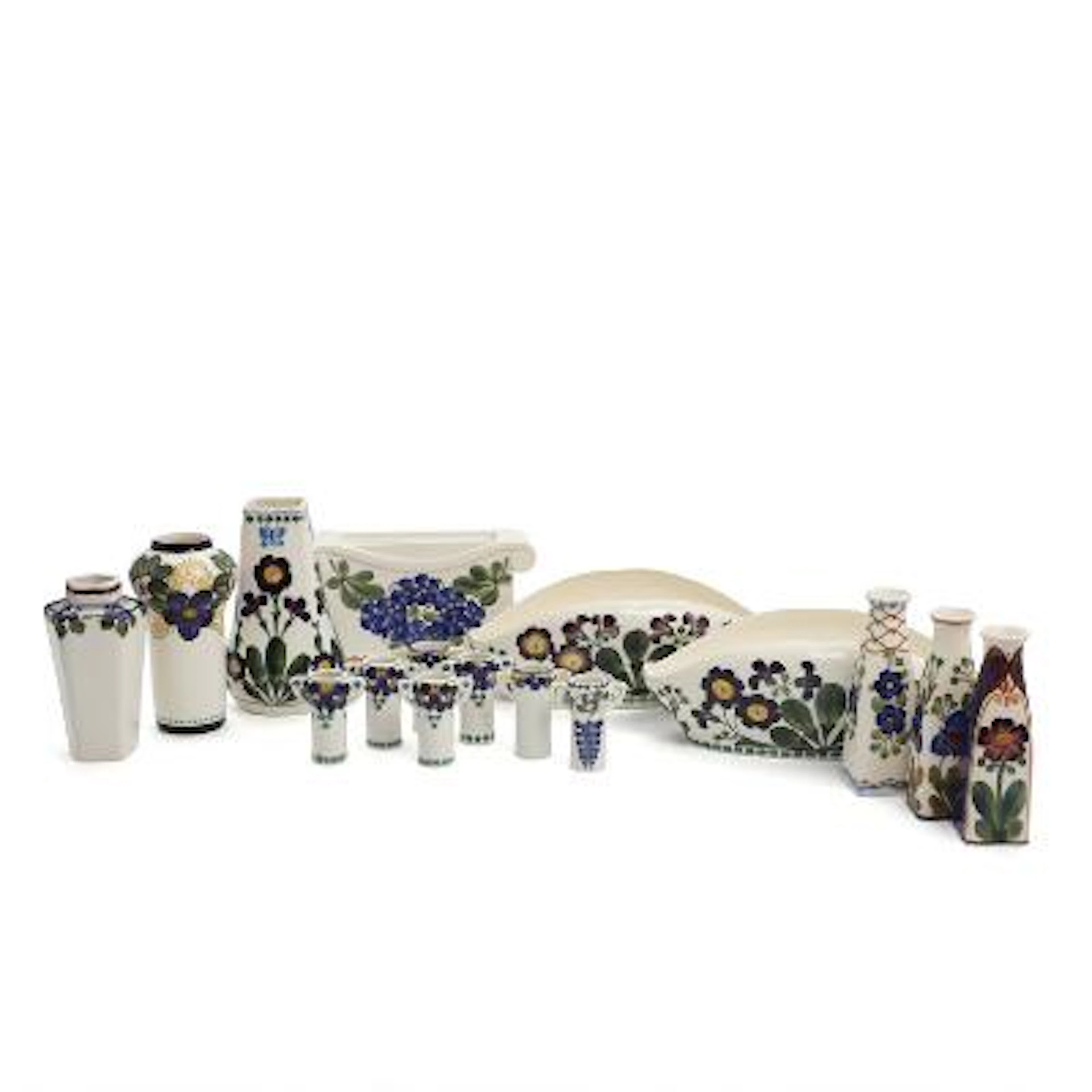 A selection of vases and jardinières of faience, decorated in colours