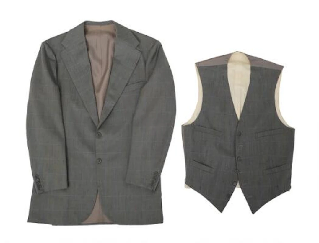 Alfred Alm: A grey jacket with matching waistcoat with a light blue