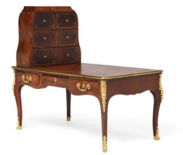 A French gilt bronze mounted rosewood and mahogany bureau plat and