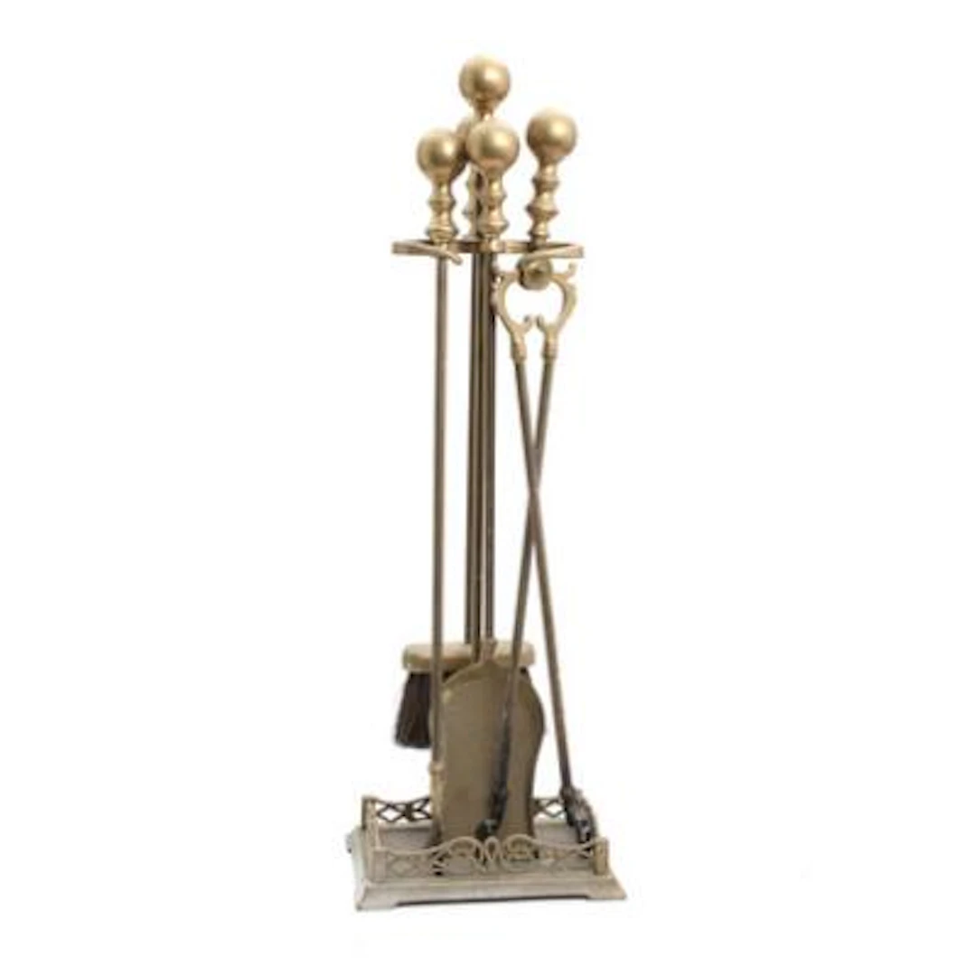 Fireplace set in brass, consisting of brush, shovel, tongs and poker.