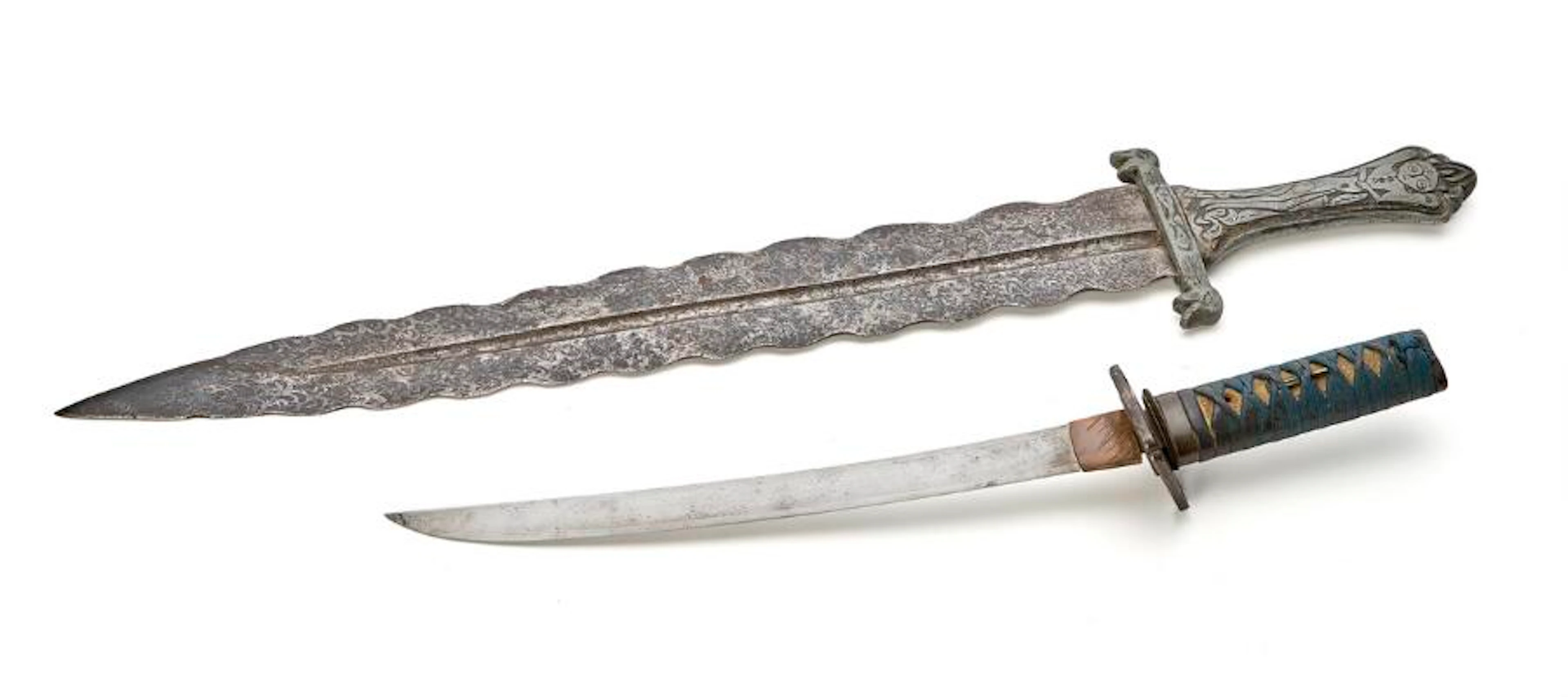 A Japanese Wakizashi in its scabbard, as well as a fantasy sword from...?