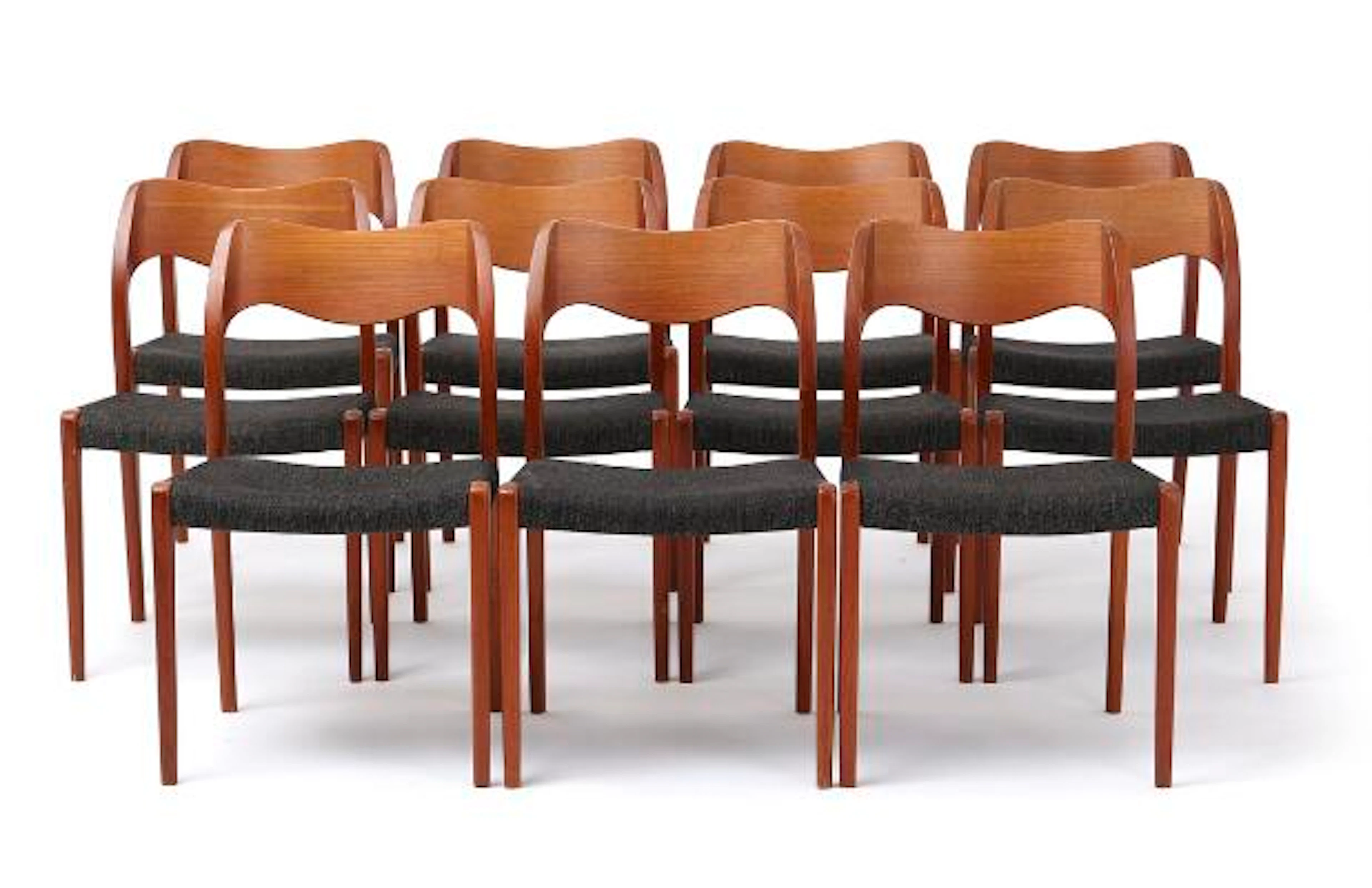 Set of eleven chairs with teak frame. Seat upholstered in grey wool.