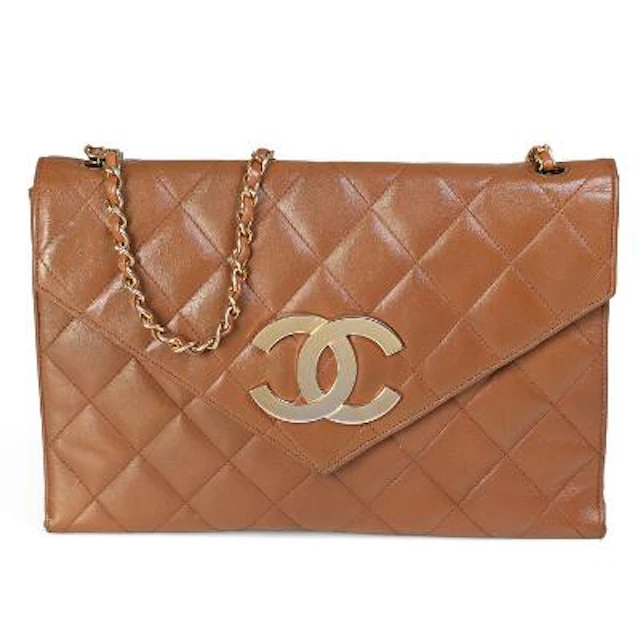Chanel: A vintage flap bag of brown quilted leather with gold tone