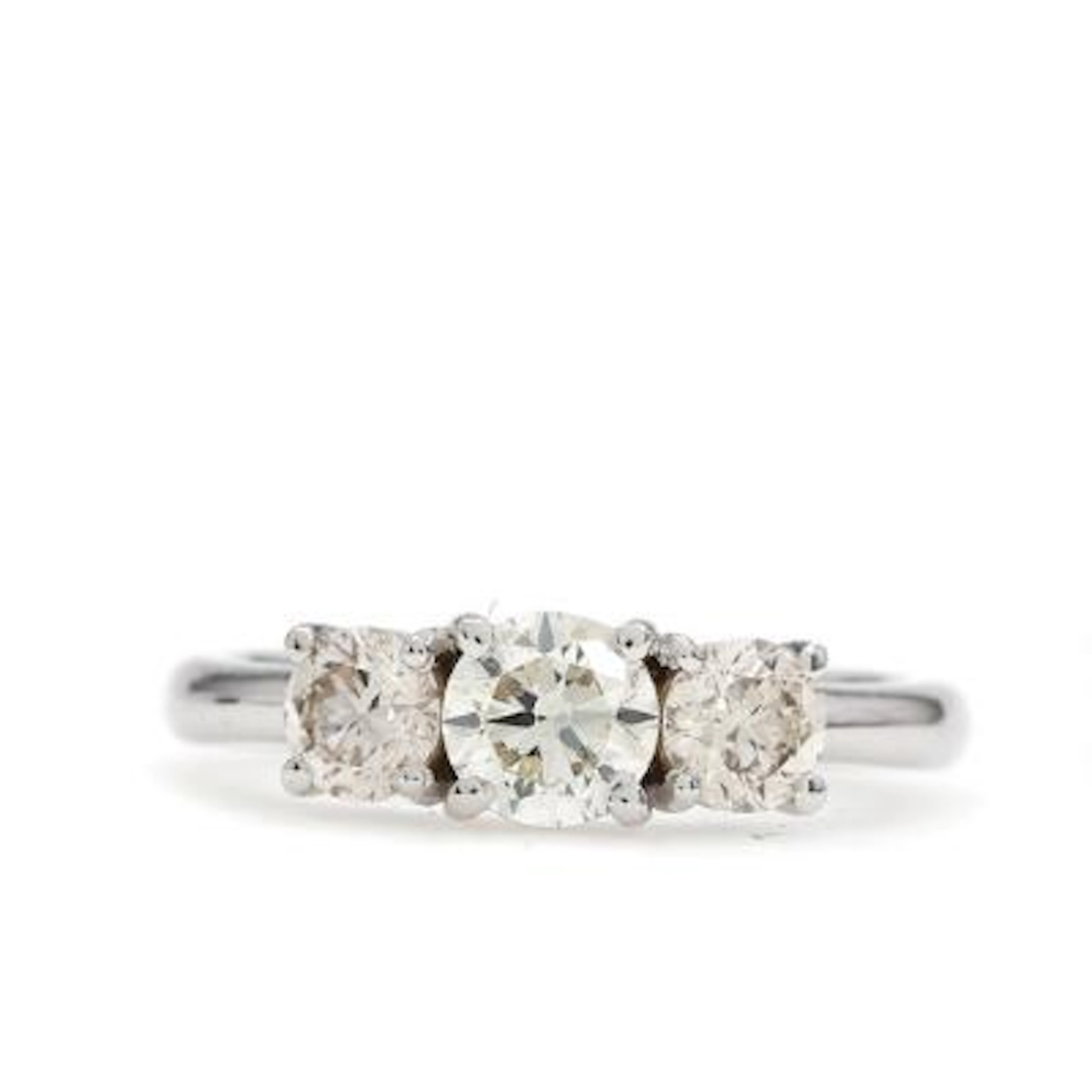 A diamond ring set with three brilliant-cut diamonds weighing a total