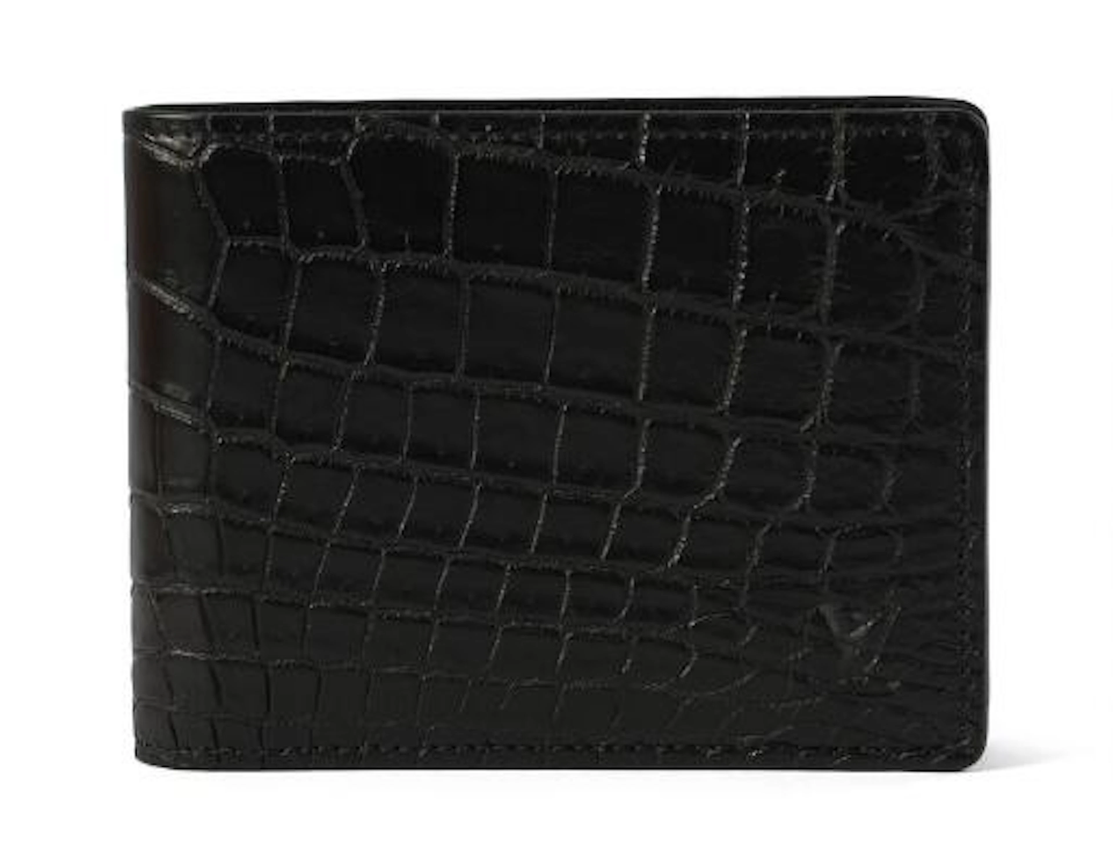 Louis Vuitton: A fold over wallet of black crocodile skin with five
