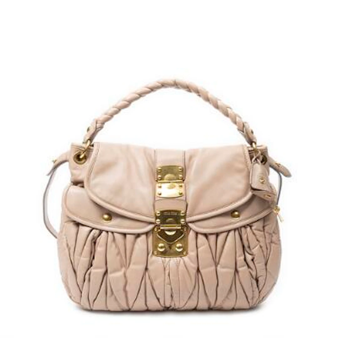 miu miu: A "Coffer Double Pocket Hobo" bag in rose Nappa Matelasse-leather
