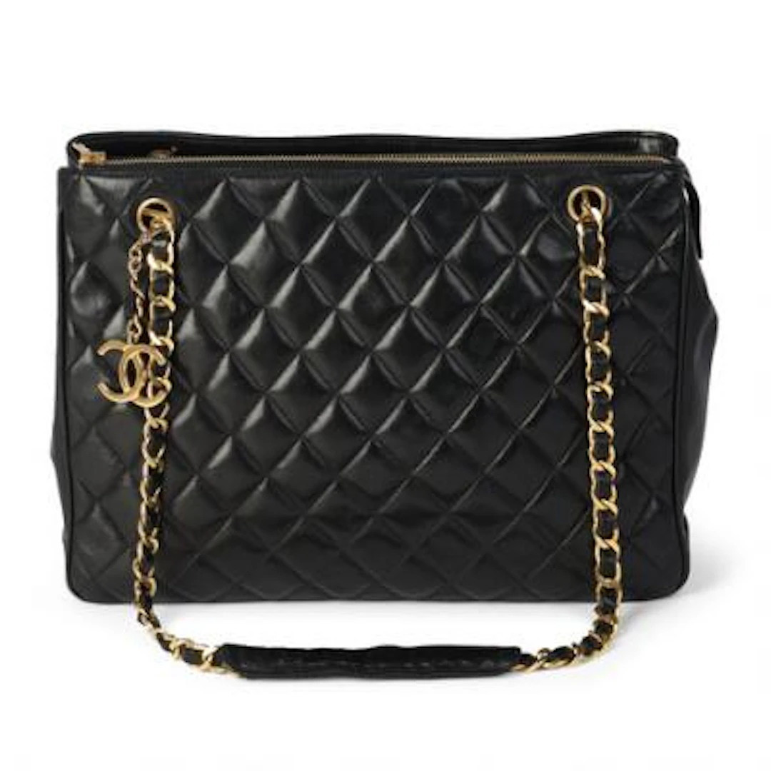 Chanel: A black vintage tote bag of black quiltet leather with gold