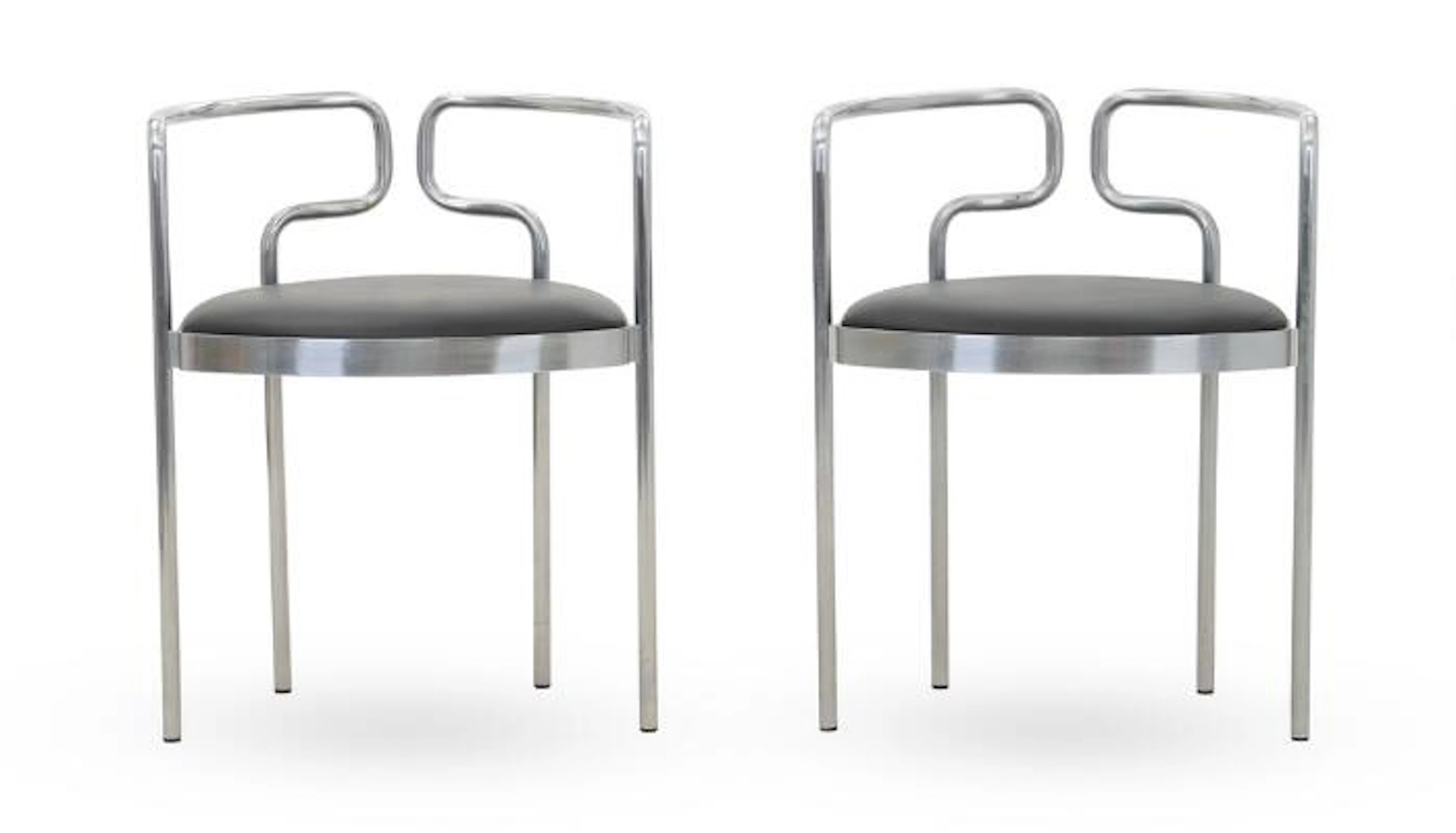 Henning Larsen: A pair of armchairs with chromed steel frame. Seat