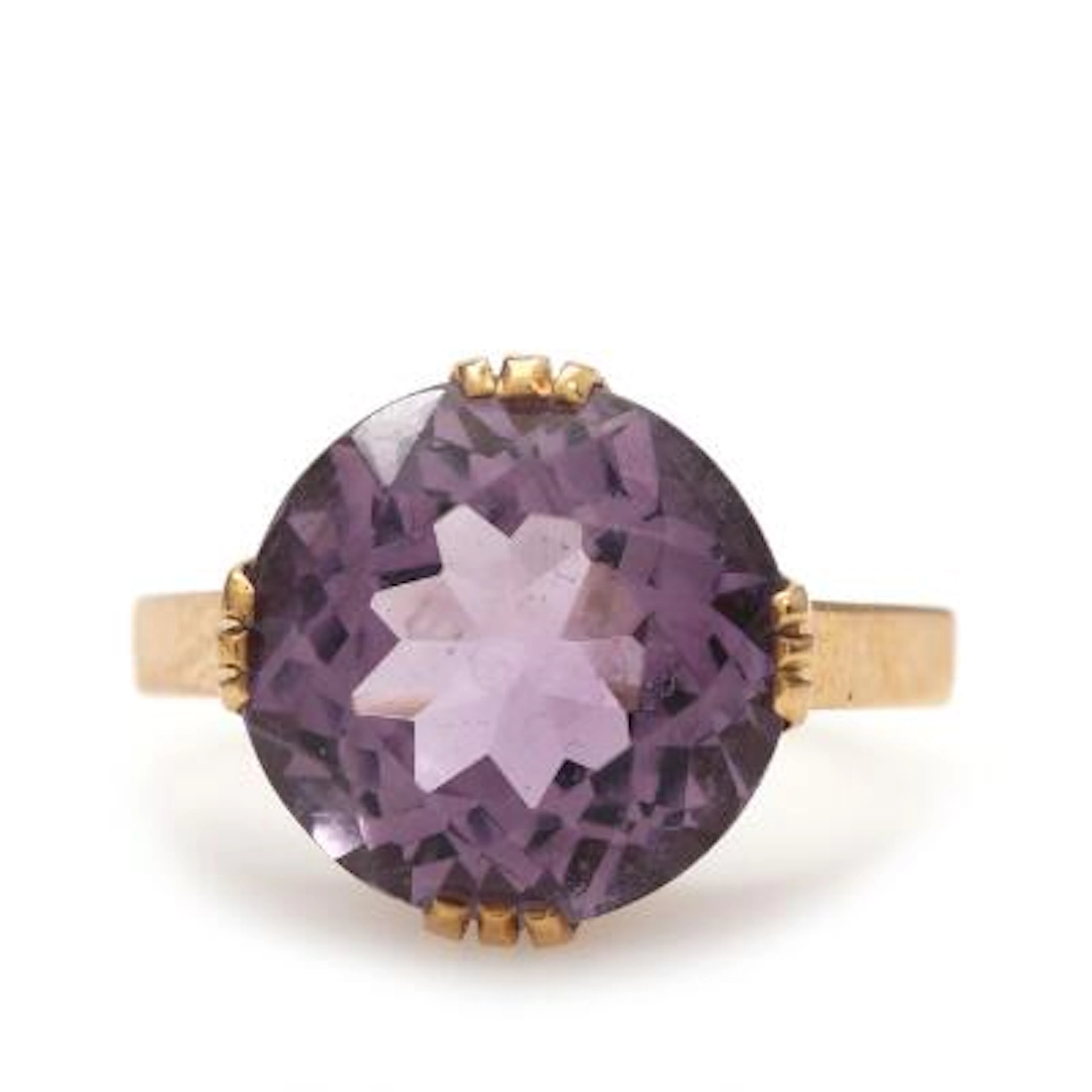 An amethyst ring set with a faceted amethyst, mounted in 14k gold.