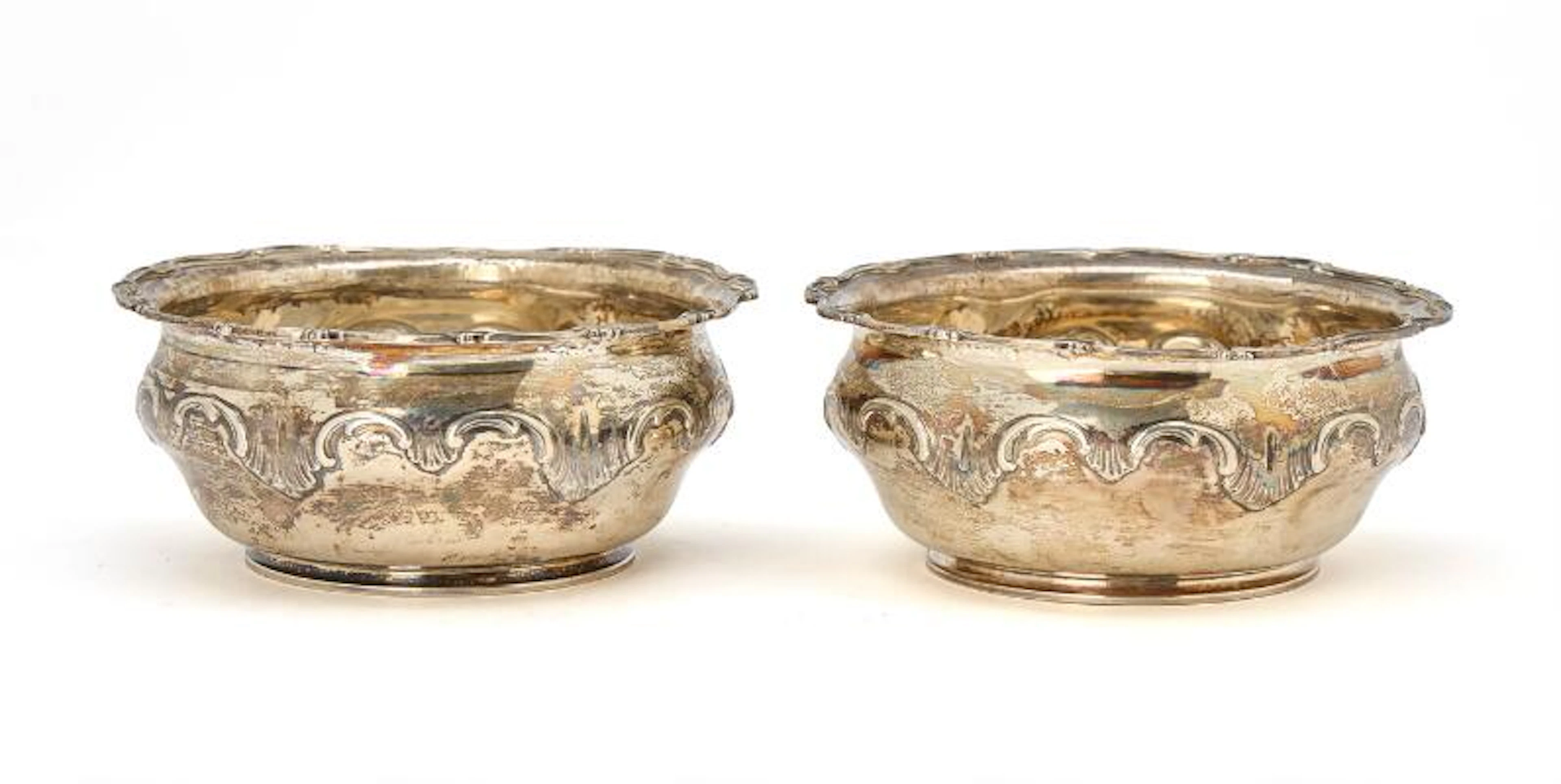 A pair of French Rococo style export bowls in sterling silver, late