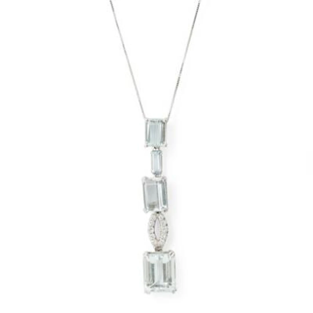 An aquamarine and diamond pendant and necklace of 18 kt white gold.