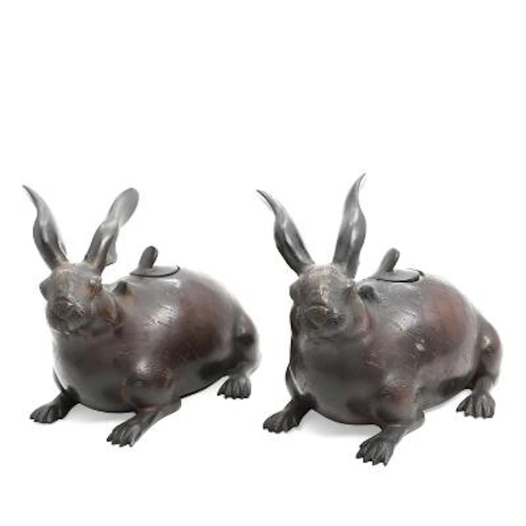 A pair of Japanese koro incense burners of patinated bronze in the