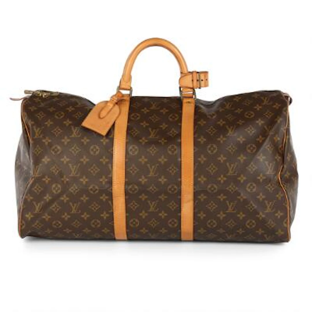 Louis Vuitton: A "Keepall 55" travel bag of brown monogram canvas