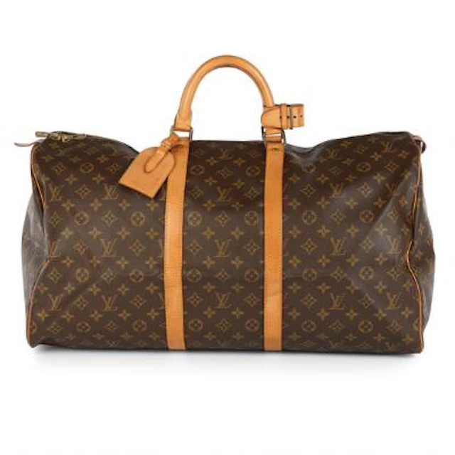 Louis Vuitton: A "Keepall 55" travel bag of brown monogram canvas