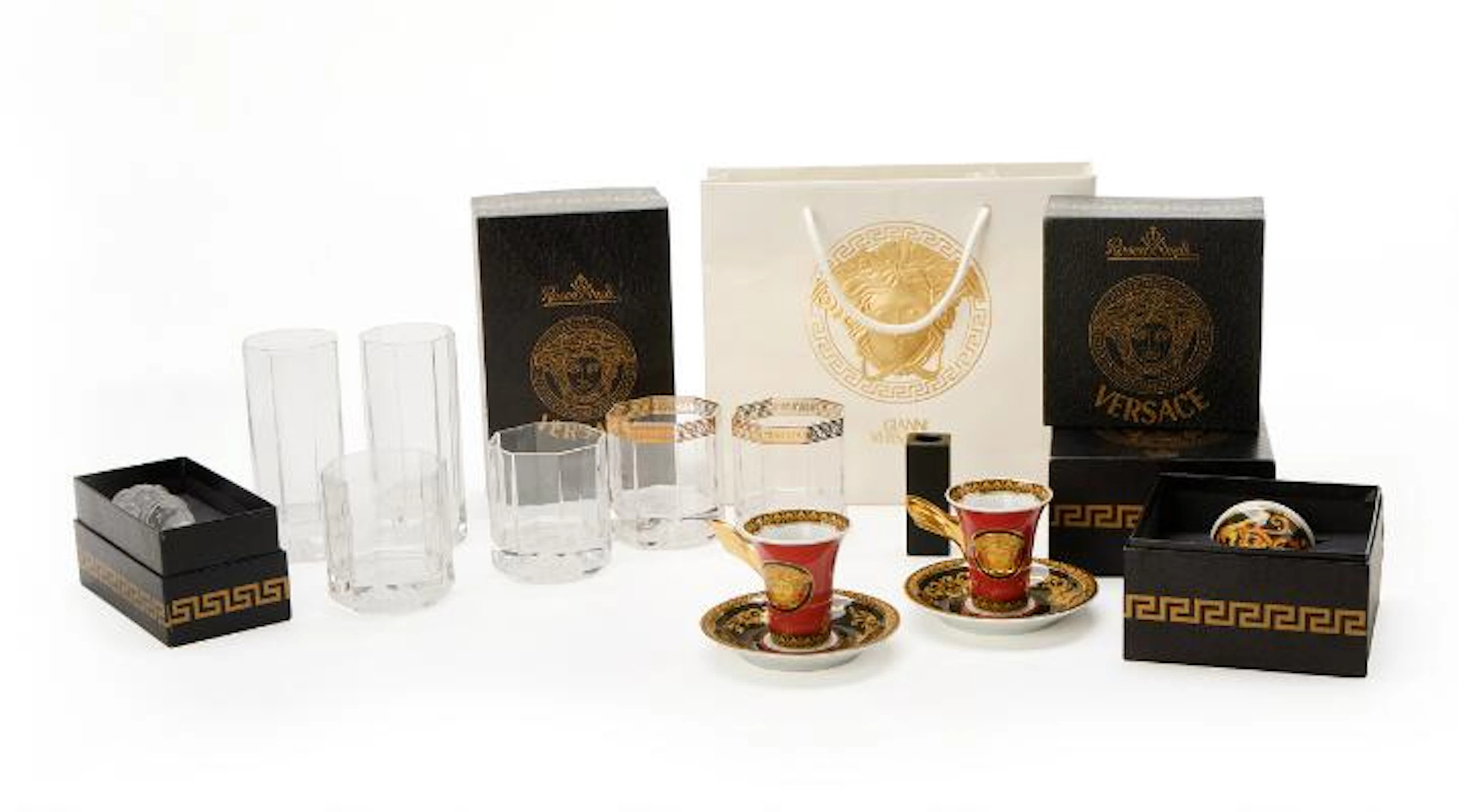 "Versace" porcelain cups and crystal glasses cast with medusa in relief